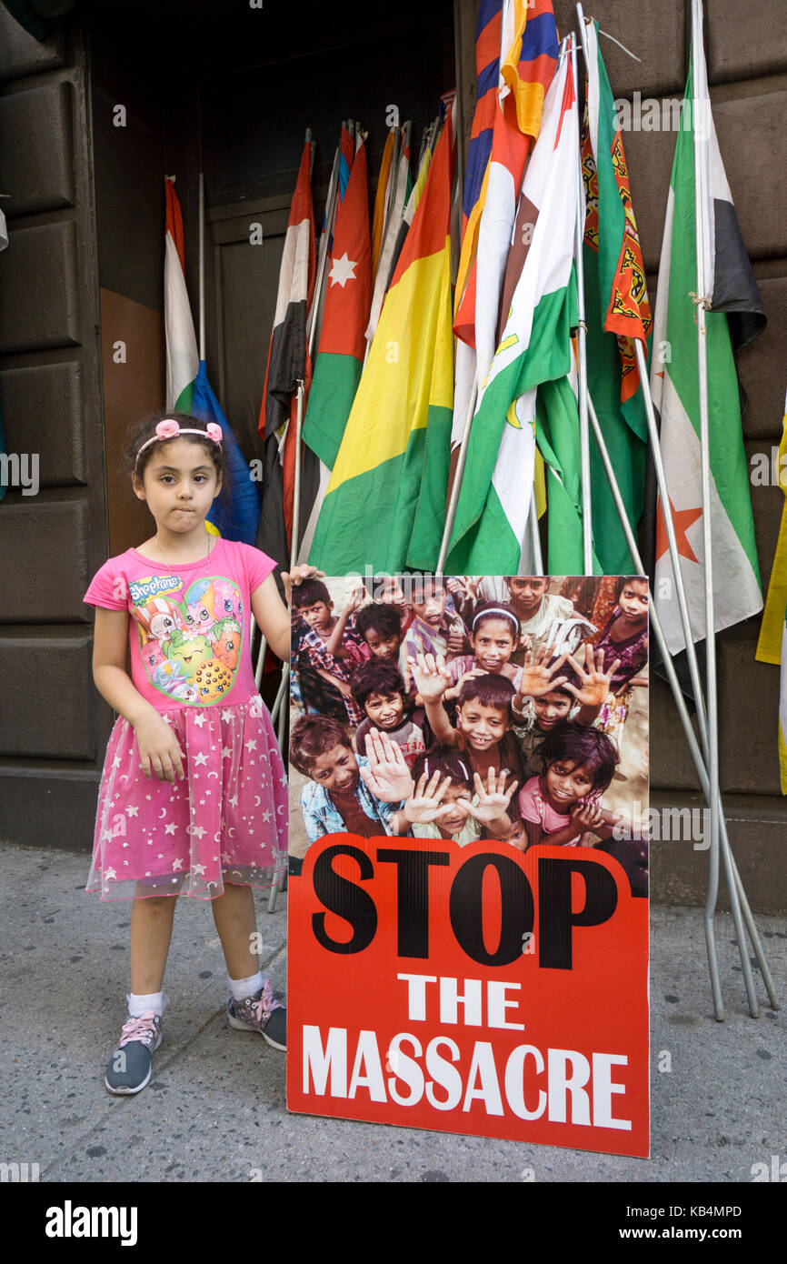 A young American Muslim girl protesting the genocide in Myanmar at he Muslim Day Parade in Midtown Manhattan, New York City. Stock Photo