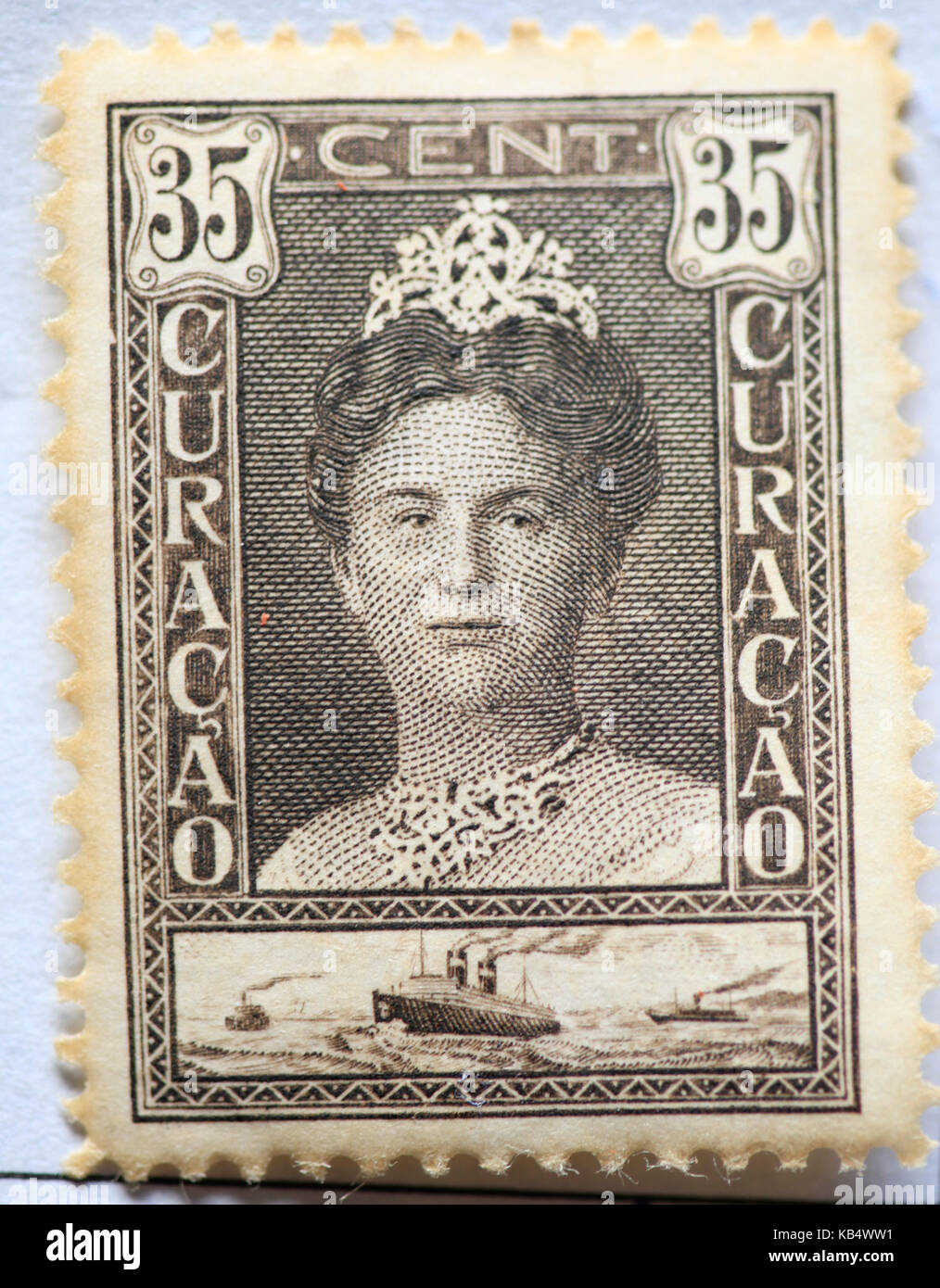 Vintage postage stamp from Curacao (then a colony of the Netherlands) with image of  Queen Wilhelmina of the Netherlands, 1928. Brown, and originally  Stock Photo