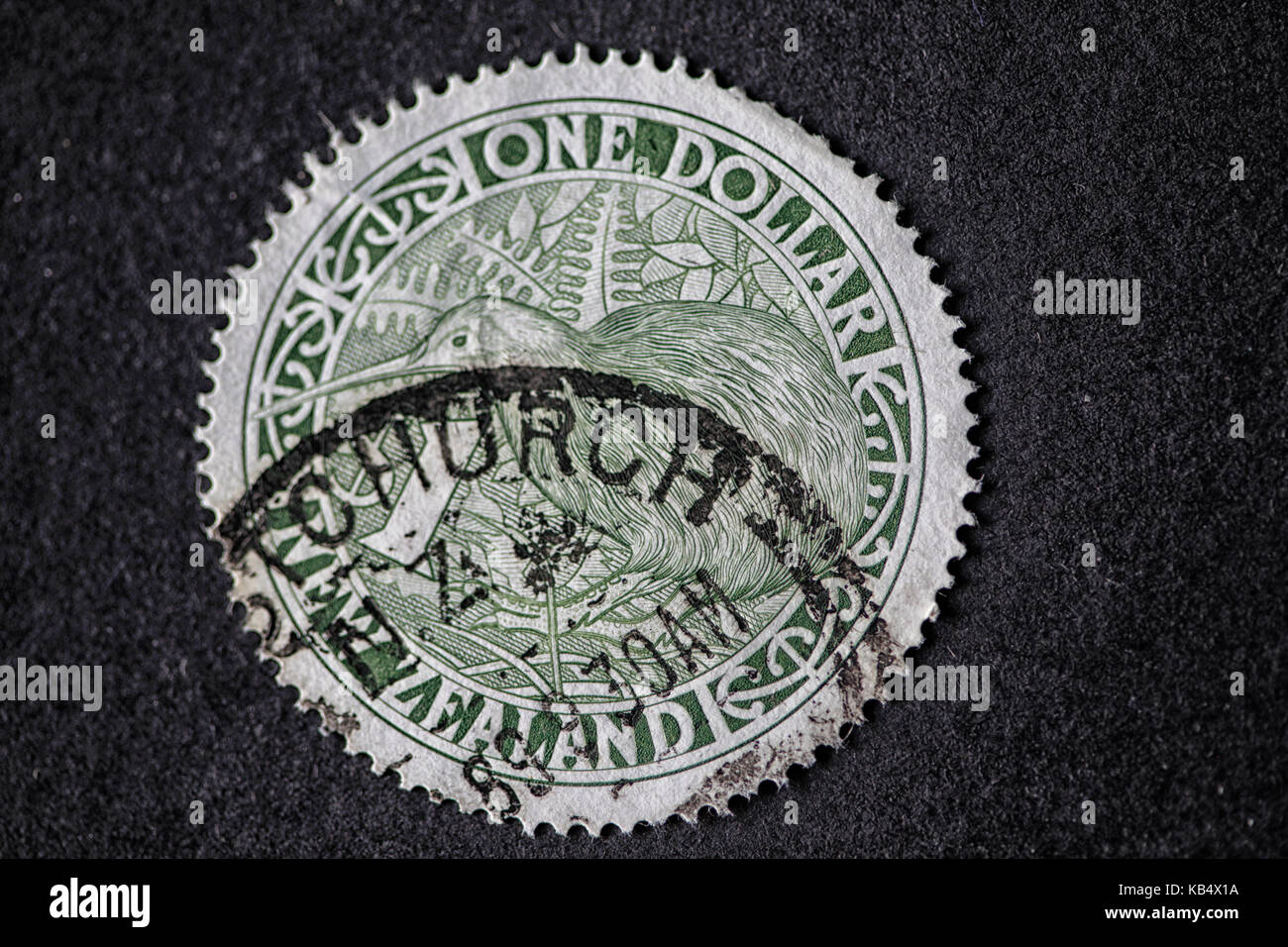 NEW ZEALAND - CIRCA 1994: A circular stamp with a kiwi printed in New Zealand shows 'one dollar', circa 1994 Stock Photo