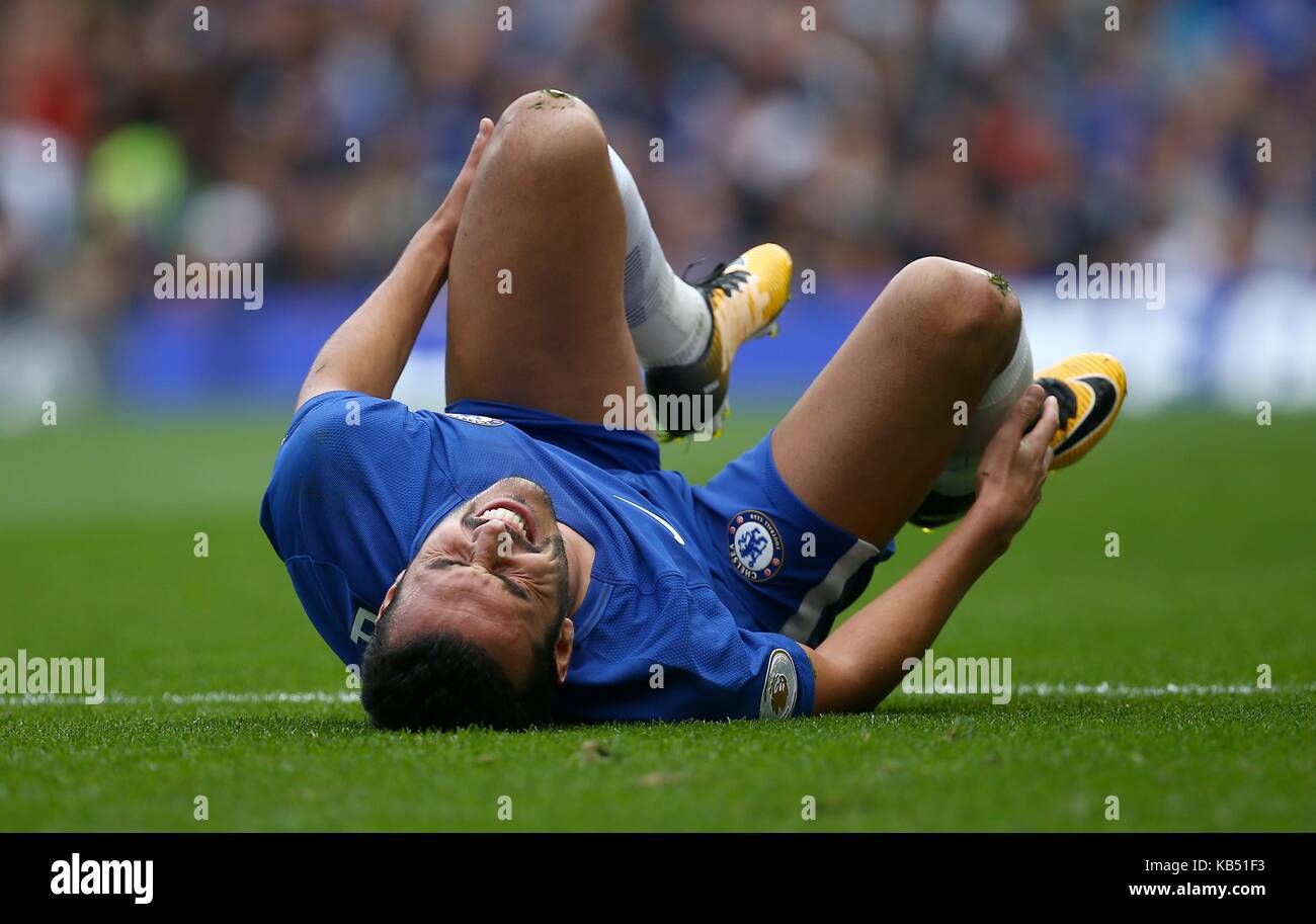 Pedro of Chelsea grimaces in pain during the Premier League match between Chelsea and Arsenal at Stamford Bridge in London. 17 Sep 2017 Stock Photo