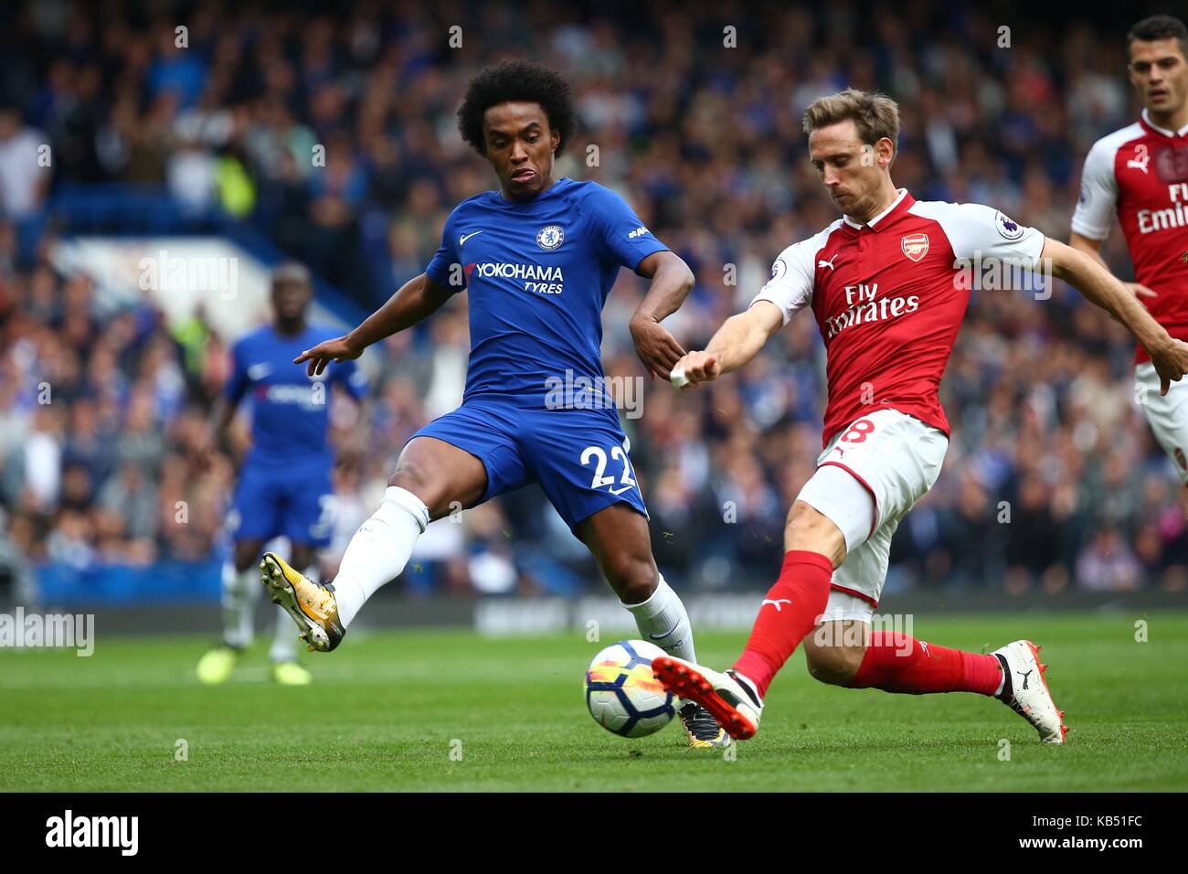 Willian of Chelsea and Nacho Monreal of Arsenal during the Premier League match between Chelsea and Arsenal at Stamford Bridge in London. 17 Sep 2017 Stock Photo