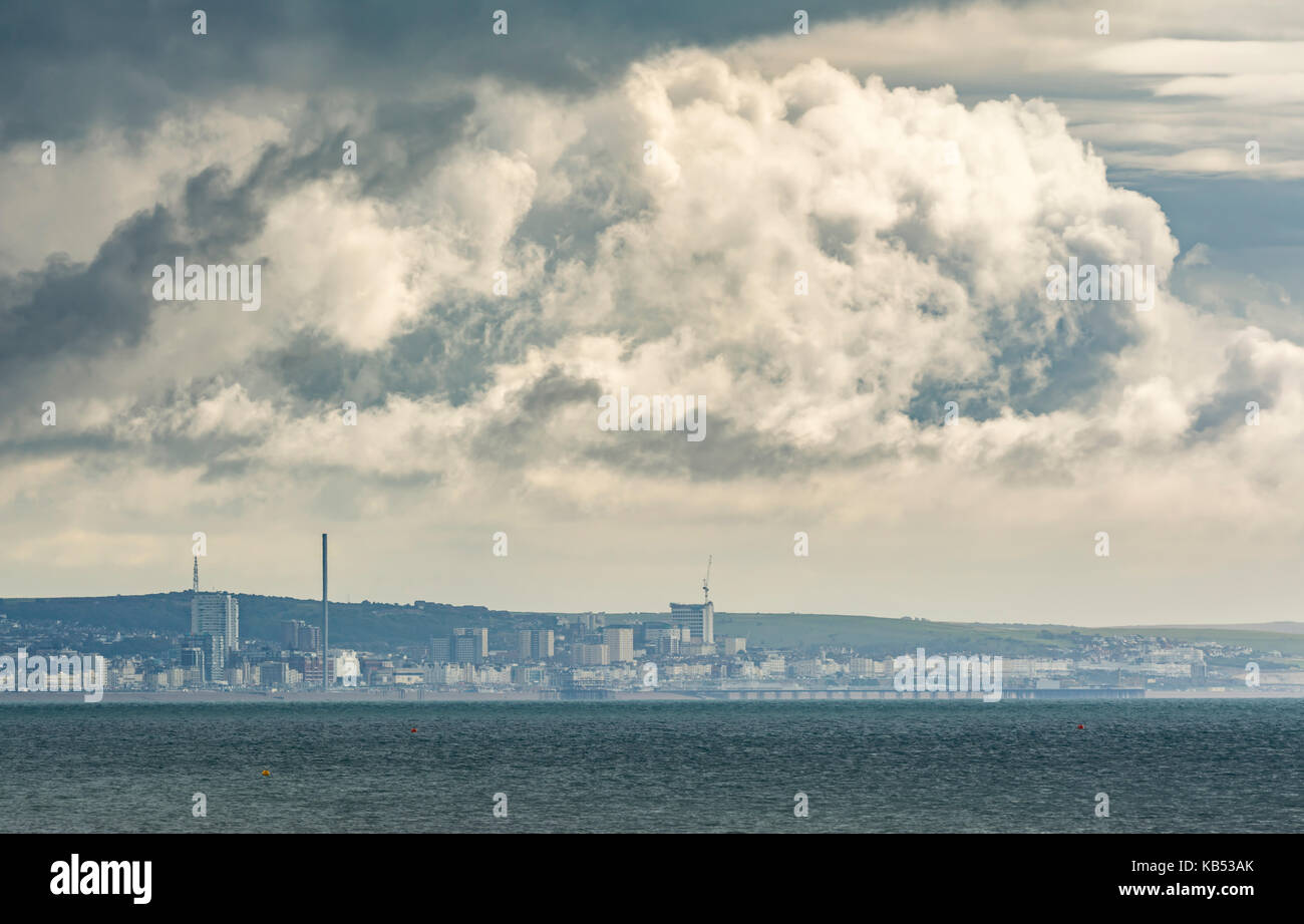 Brewing storm clouds developing over the sea on the south coast in the UK. Stock Photo