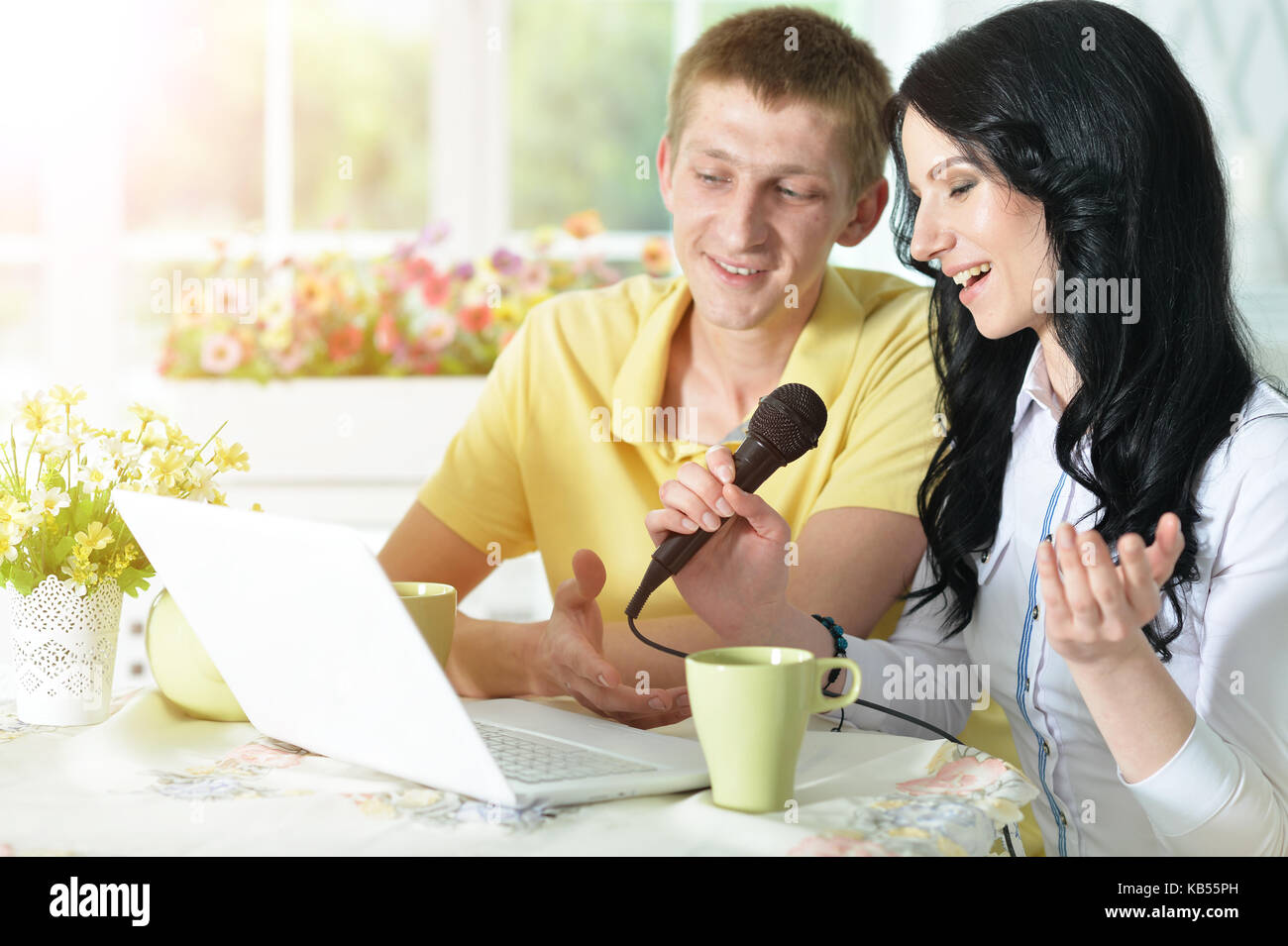 Young couple with laptop Stock Photo - Alamy
