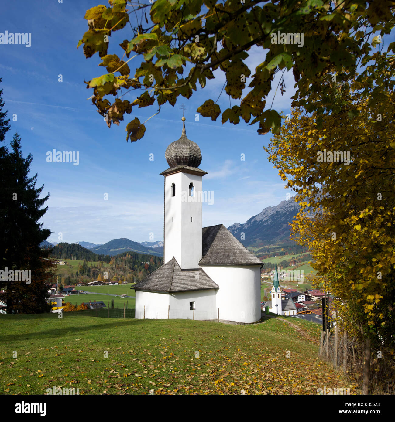 Austria, Tyrol, Ellmau, typical small village and church before the Wilder Kaiser mountains Stock Photo