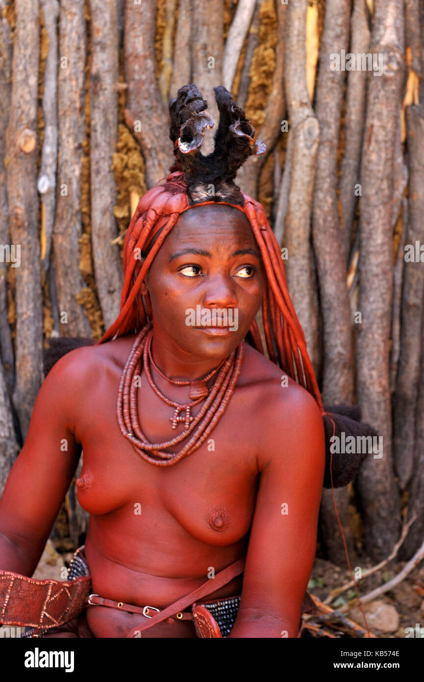 Namibia, Kaokoland or Kaokoveld, Himba village, young himba woman Stock Photo