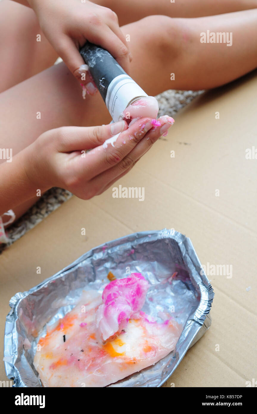 handicraft instruction, step by step, build torches by yourself, seal the cavity at top of the torch with wax, picture series with text Stock Photo