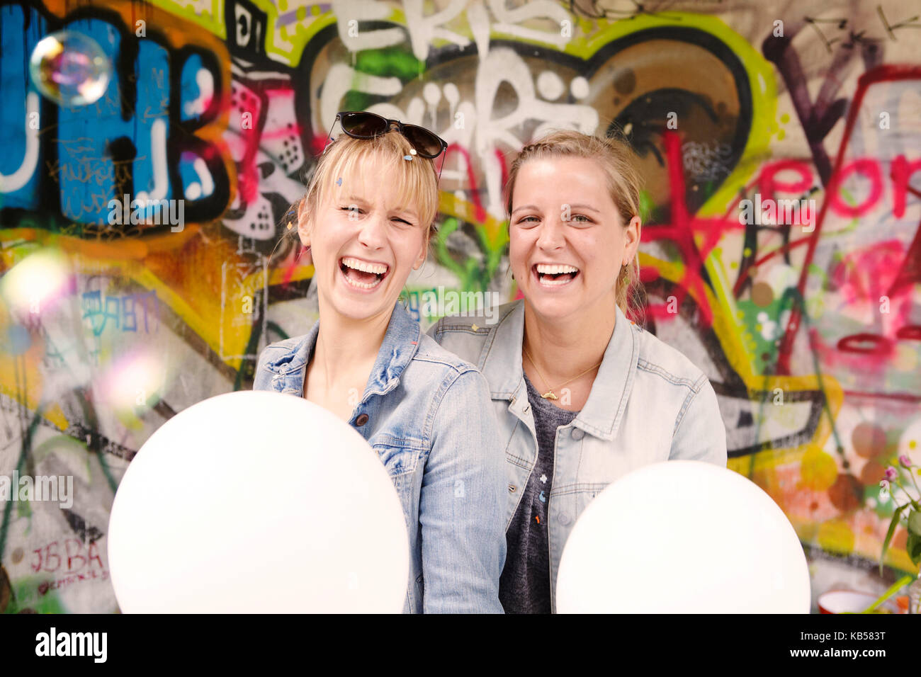 Girlfriends at a bachelorette party, confetti, balloons, laughing, fun, Stock Photo