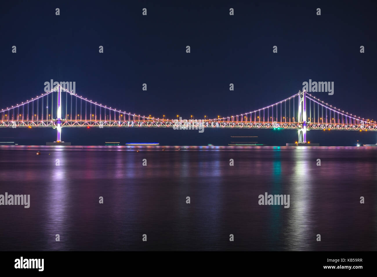 Gwangalli beach and Gwangan bridge at night in Busan of South Korea. Stock Photo