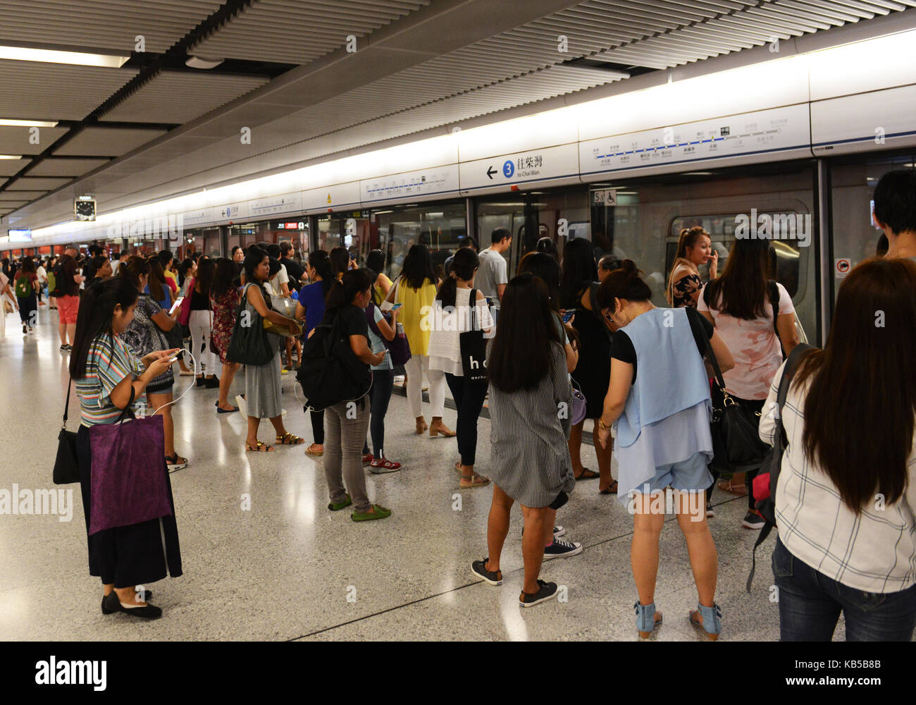 Passengers waiting for the MTR Island line train in Hong Kong's Central