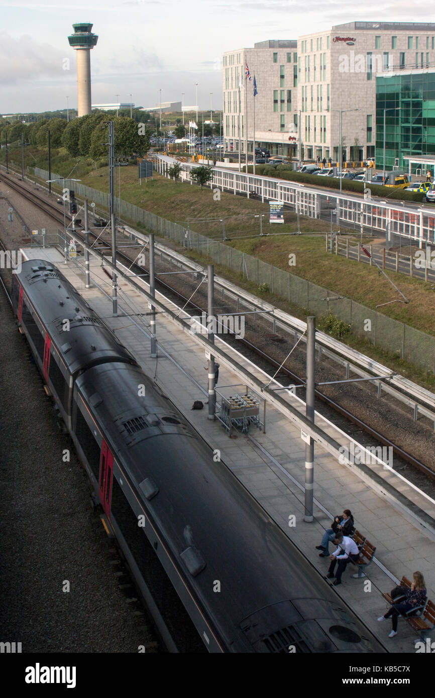 CrossCountry train on platform, in front of air traffic control tower