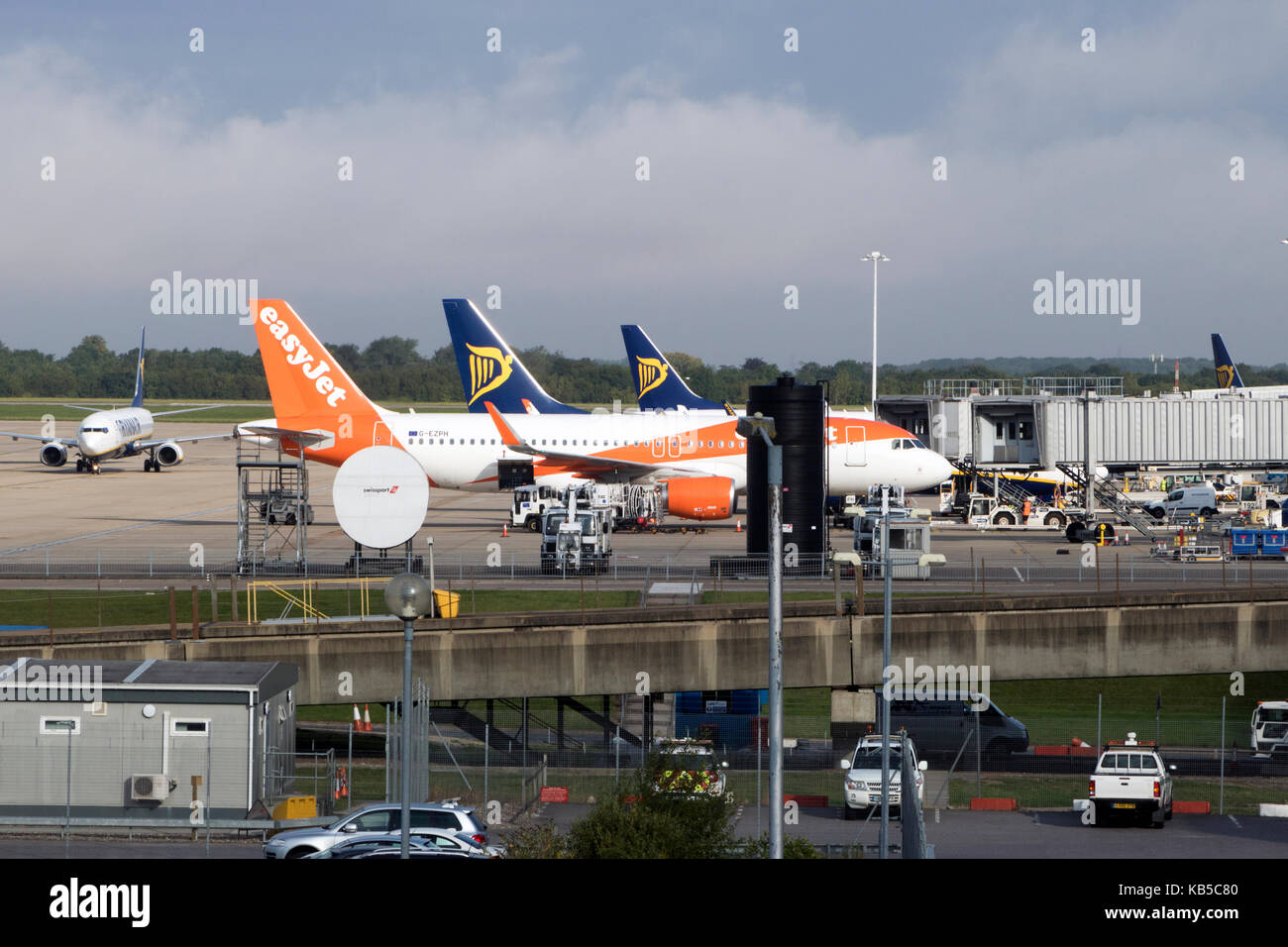 Two Ryanair aircraft and an easyJet plane waiting on the apron at