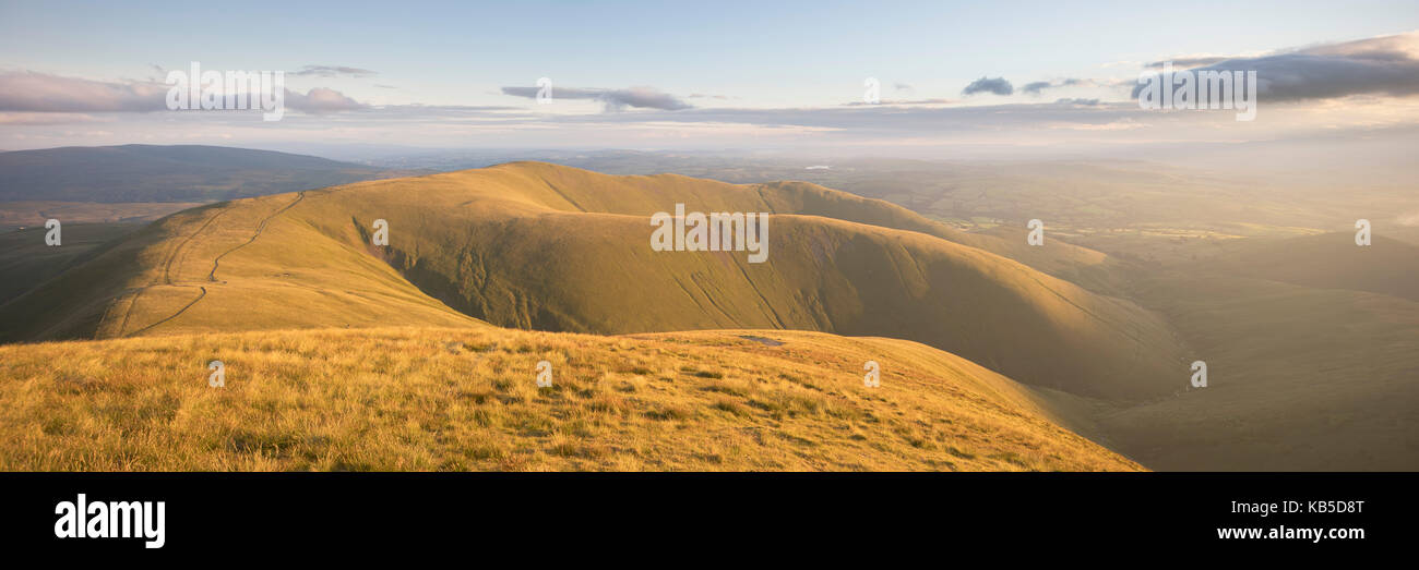 Arant Haw and the Howgill Fells lit by evening light from the summit of Calders, Sedbergh, Yorkshire Dales, Cumbria, England, UK Stock Photo