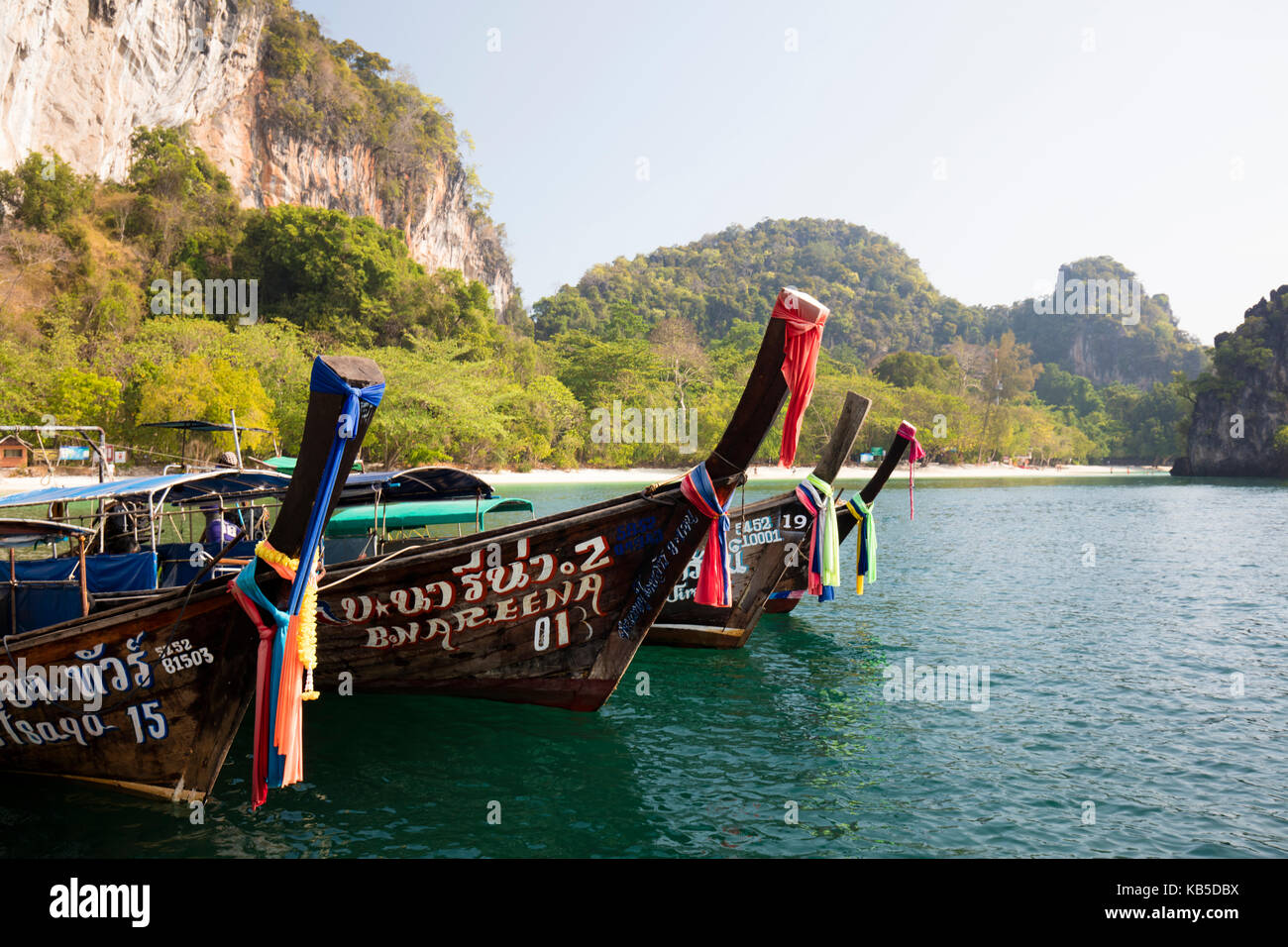Traditional longtail boats and limestone cliffs, Hong Island, one of the Koh Hong Islands, Ao Nang, Krabi, Thailand Stock Photo