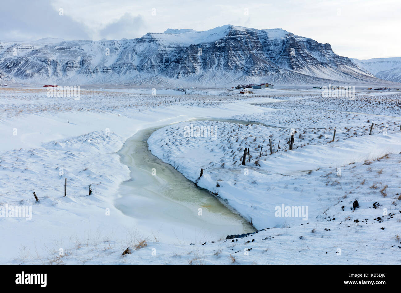 Stunning snow covered winter landscape bathed in afternoon sunlight, on the road to the Snaefellsnes Peninsula, Iceland Stock Photo