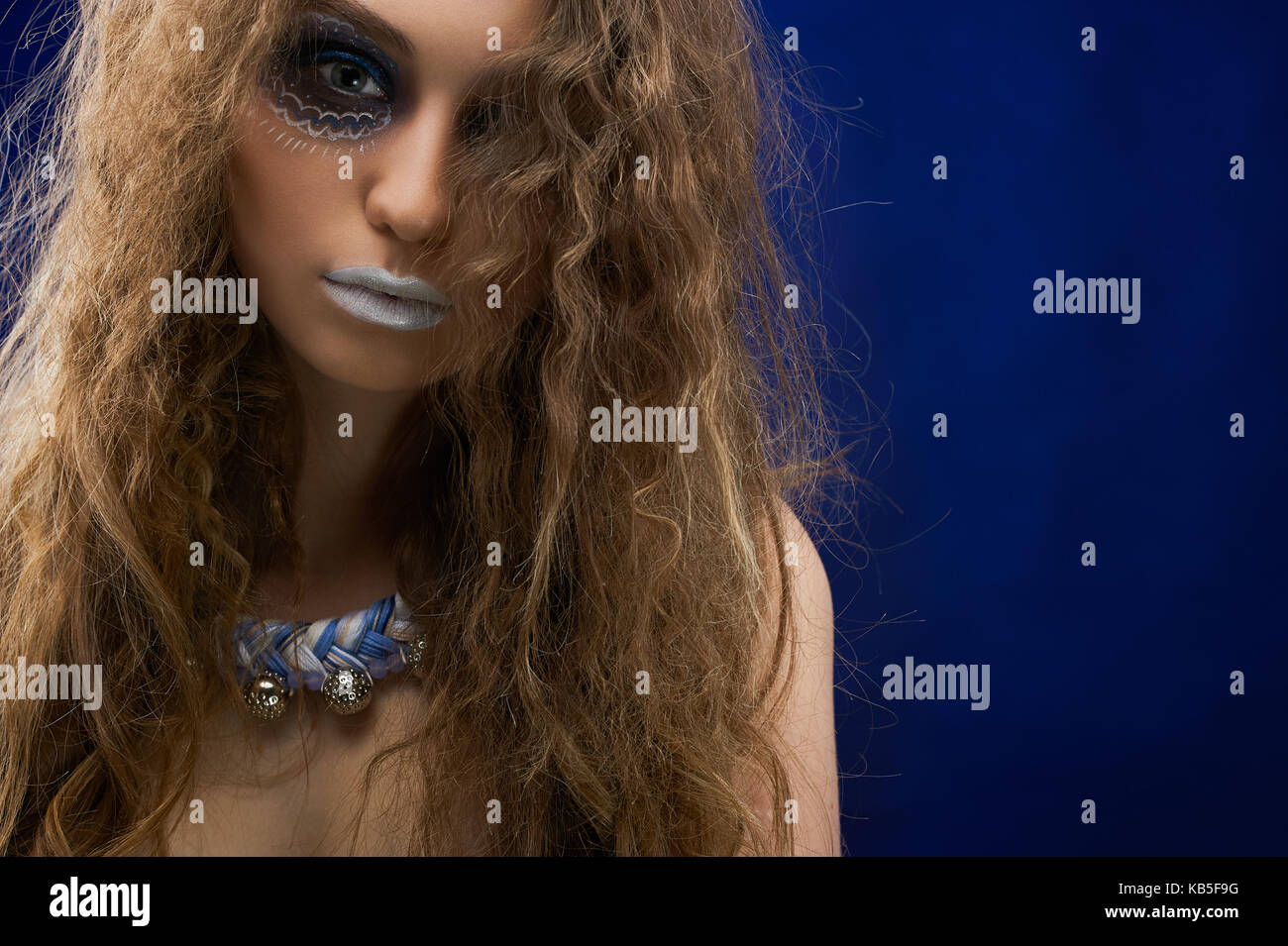 A portrait of a girl with curly hair Stock Photo - Alamy