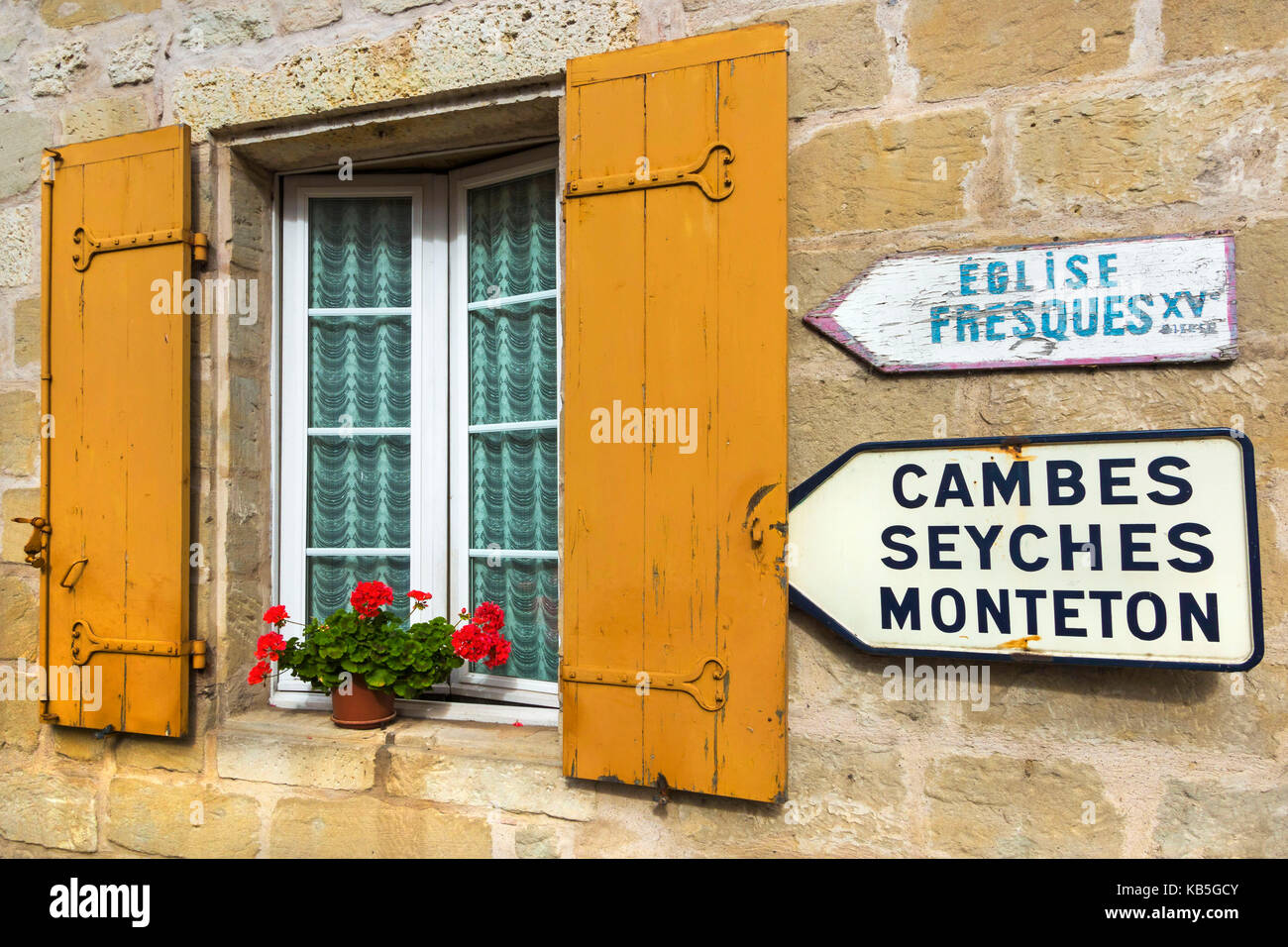 Shuttered window and signs in this old village on the Dropt River near Duras, Lot-et-Garonne, Aquitaine, France, Europe Stock Photo