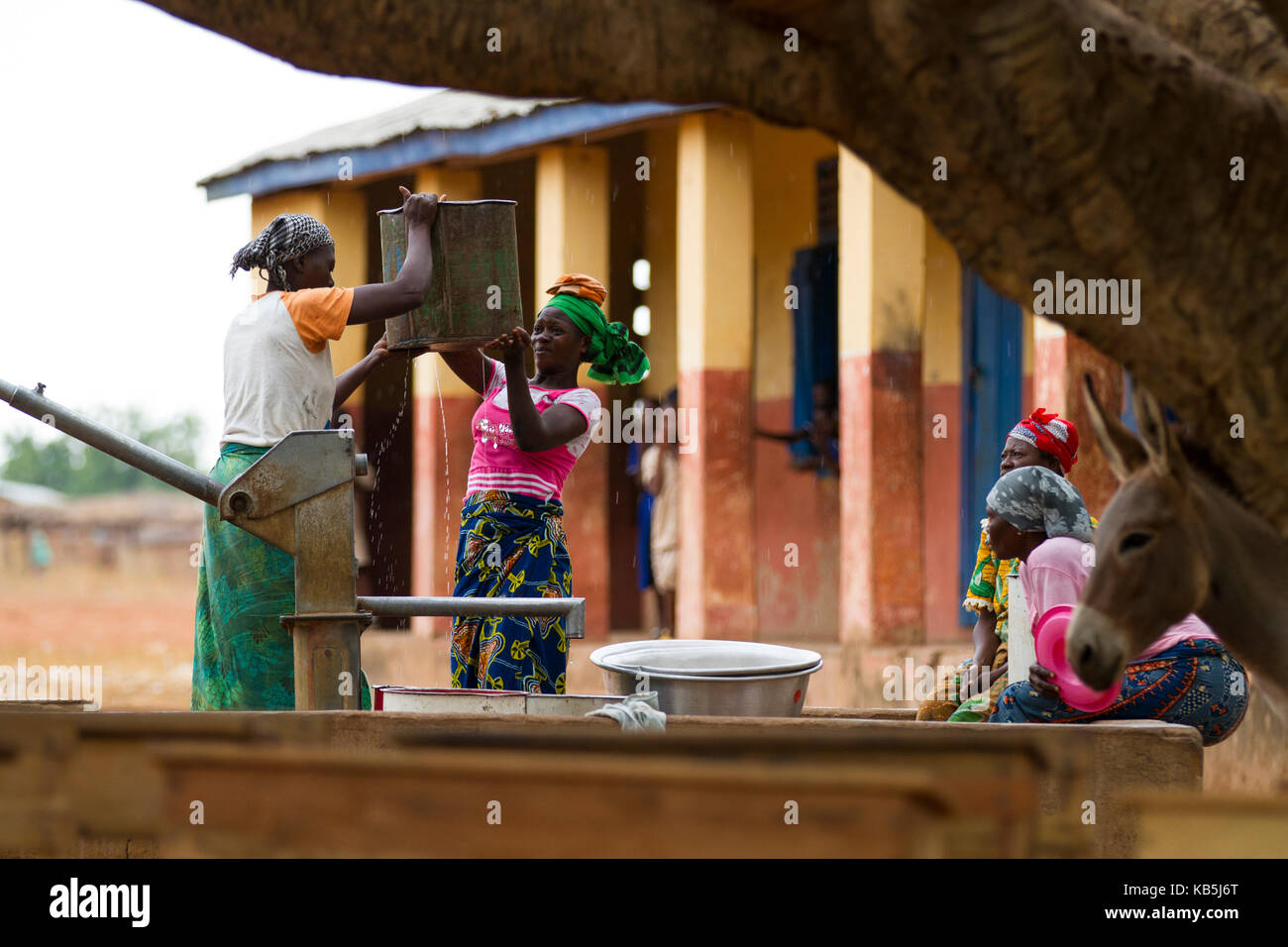 Women collecting water from one of the community water pumps in Tinguri