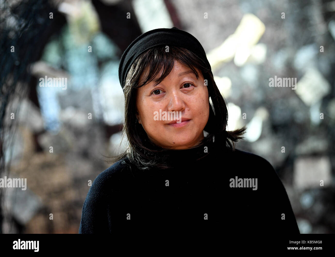 Japanese artist Chiharu Shiota stands in her installation 'Lost Words