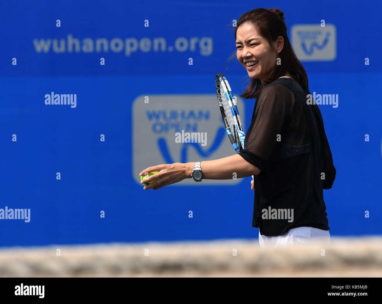 Wuhan, China. 28th Sep, 2017. Chinese two-time Grand Slam champion Li Na shows tennis skills to young players during the 2017 WTA Wuhan Open Project event in Wuhan, capital of central China's Hubei Province, on Sept. 28, 2017. Credit: Xinhua/Alamy Live News Stock Photo