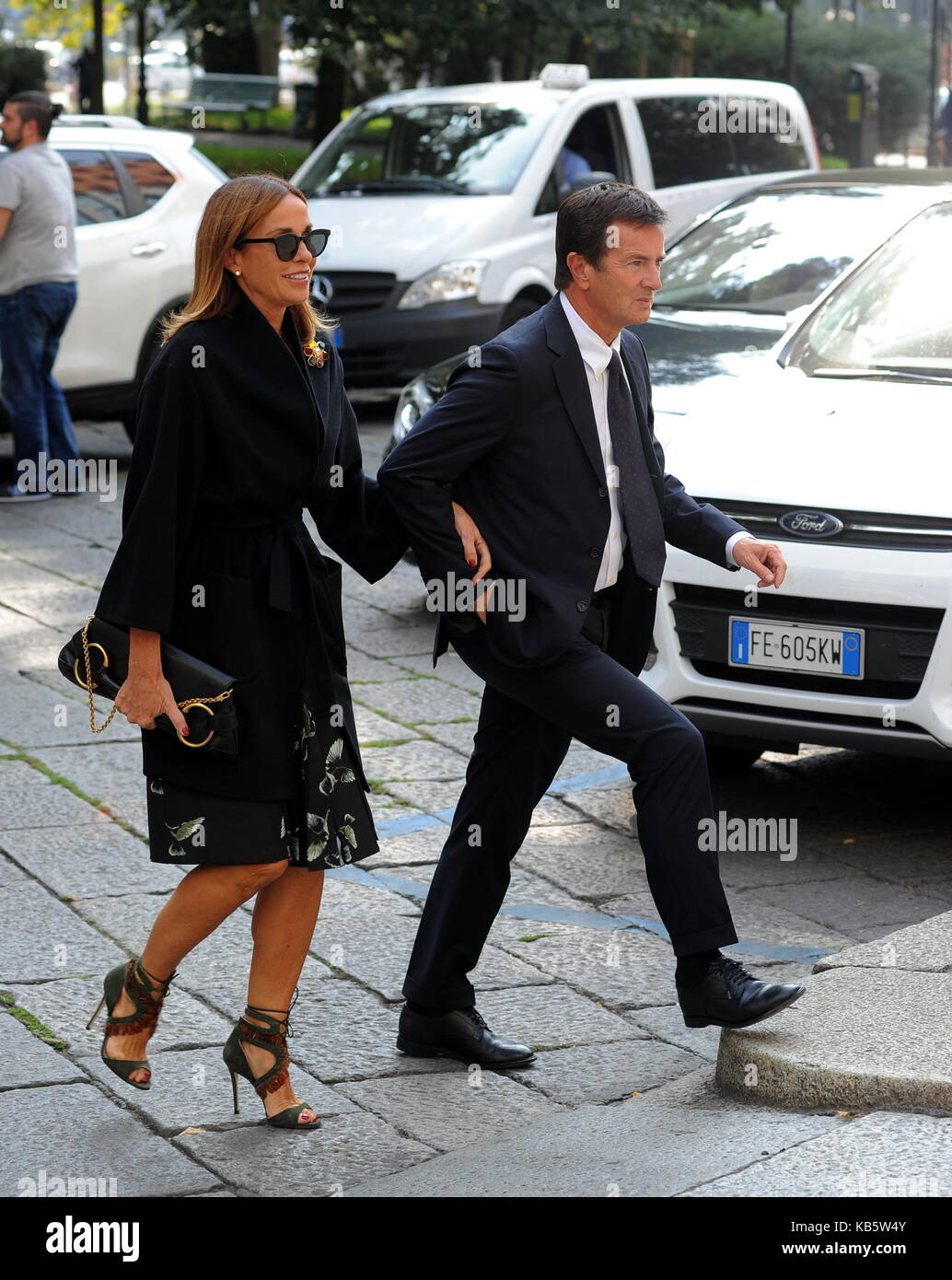 Milan, Cristina Parodi and her husband Giorgio Gori go to the Giornalismo Prize The Mayor of Bergamo Giorgio Gori arrives in advance and calls his wife Cristina Parodi to find out where she is. After a few minutes Cristina Parodi arrives by taxi, and the two hug and kiss, then come to the hotel to attend the Prize is Journalism. Also sister Benedetta Parodi was present, with whom she ate at the buffet. Stock Photo