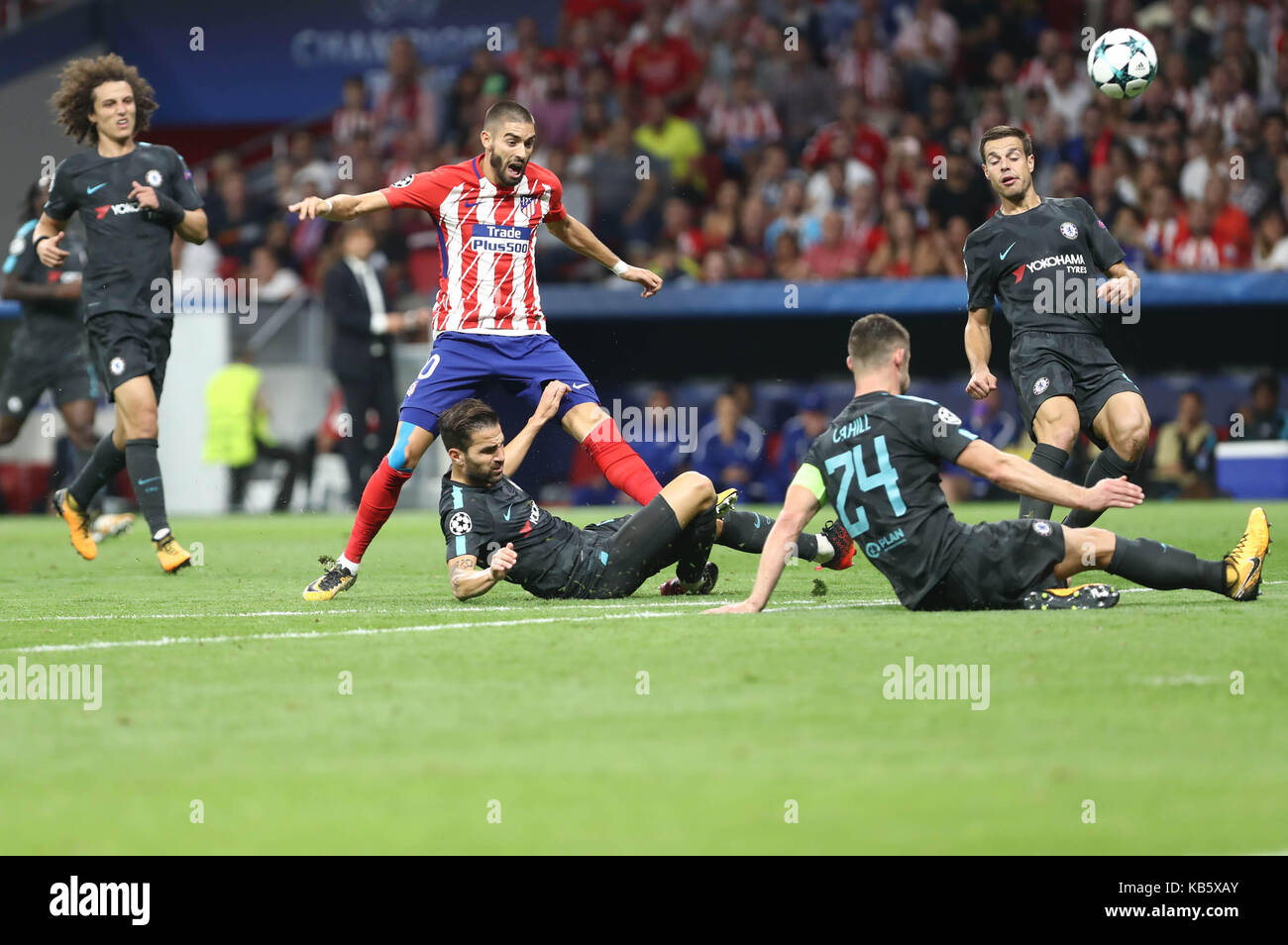 Madrid, Spain. 27th Sep, 2017.Ces Fabregas , César Azpilicueta and Gary Cahill (Chelsea FC) in action covered by Yannick Carrasco  (Atletico Madrid) during the football match of group stage of 2017/2018 UEFA Europa League between Club Atletico de Madrid and Chelsea Football Club at Wanda Metropolitano Stadium on September 27, 2017 in Madrid, Spain Stock Photo