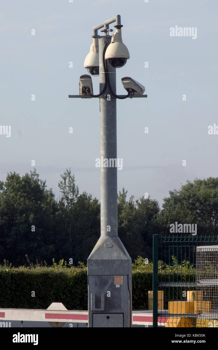 An array of CCTV cameras attached to a post at Stansted Airport