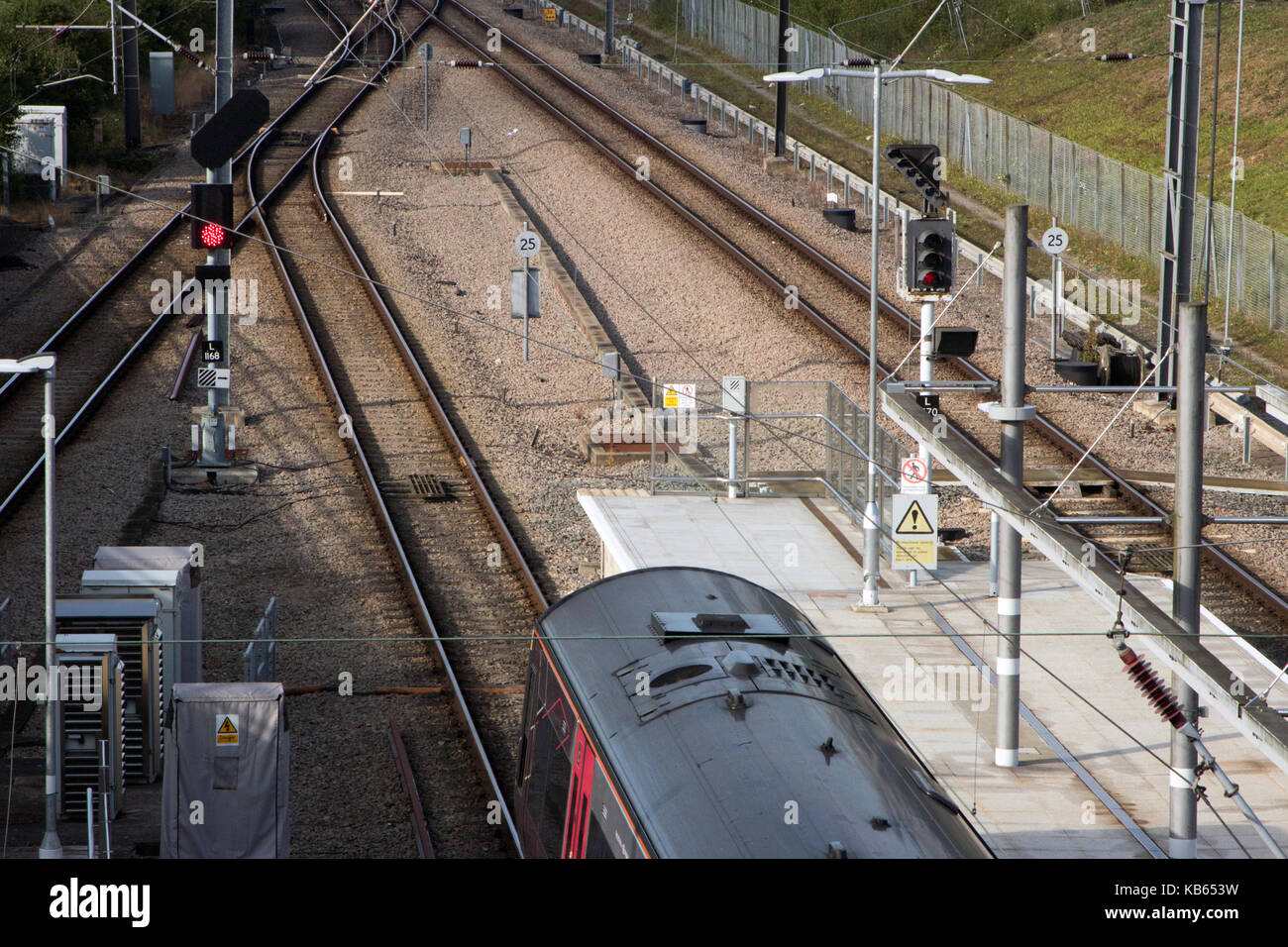 CrossCountry train stopped at a red signal at Stansted Airport's train