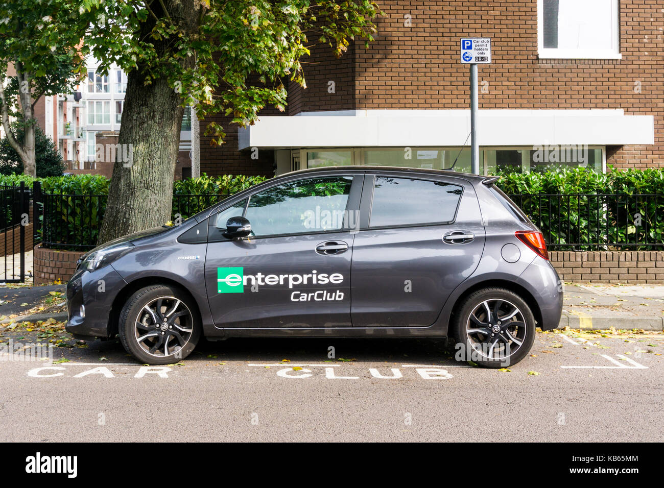 An Enterprise Car Club hybrid car in a preferential dedicated Car Club Members only parking space. Stock Photo