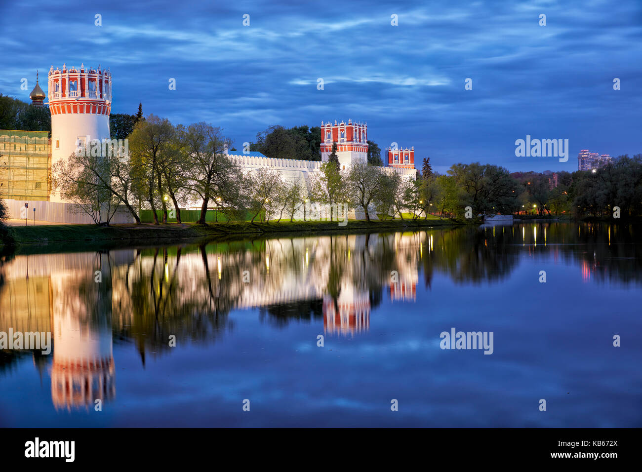 Outer wall of the Novodevichy Convent illuminated at dusk. Moscow, Russia. Stock Photo