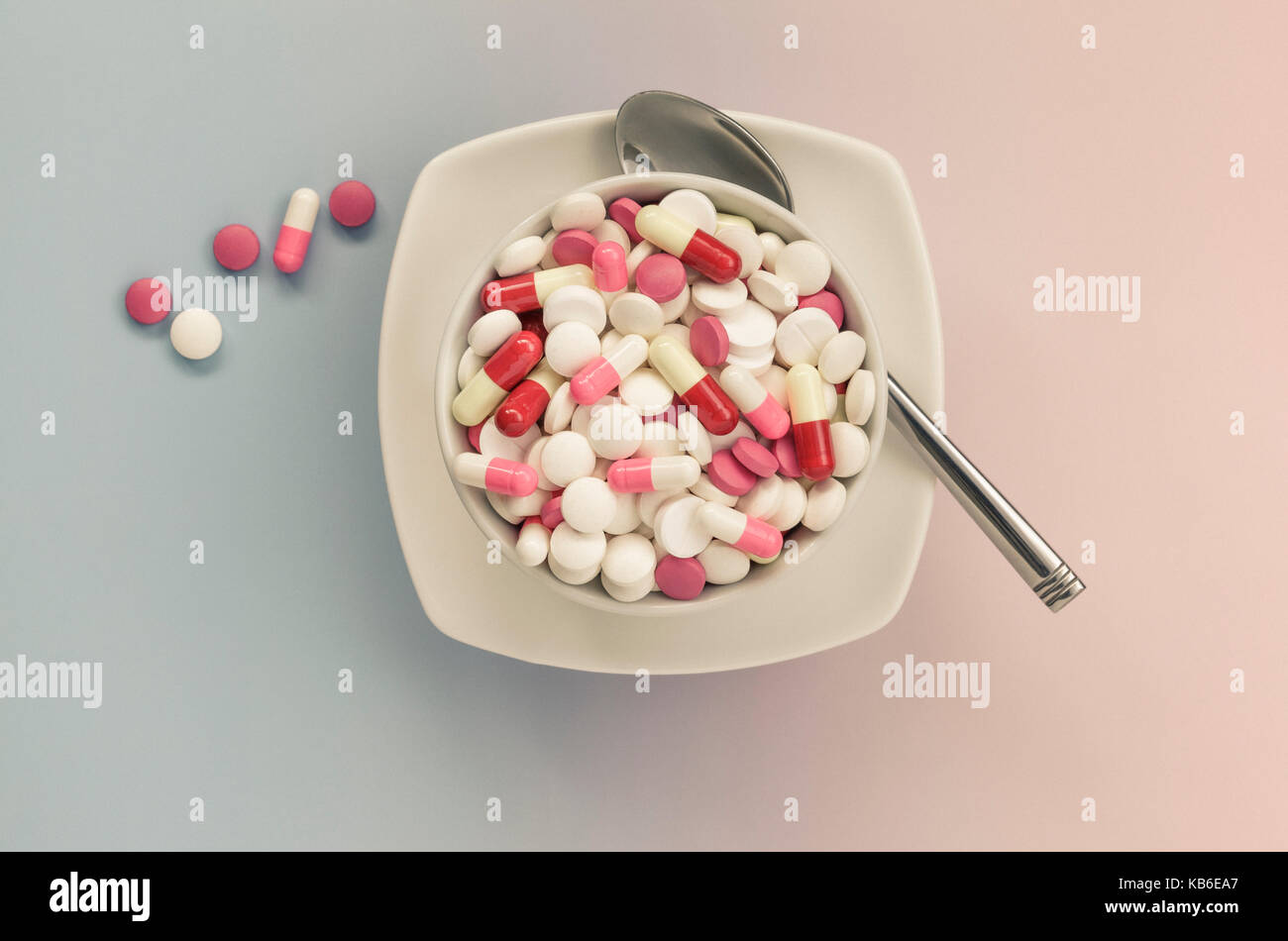 Mixed painkillers ,pills in white bowl Stock Photo