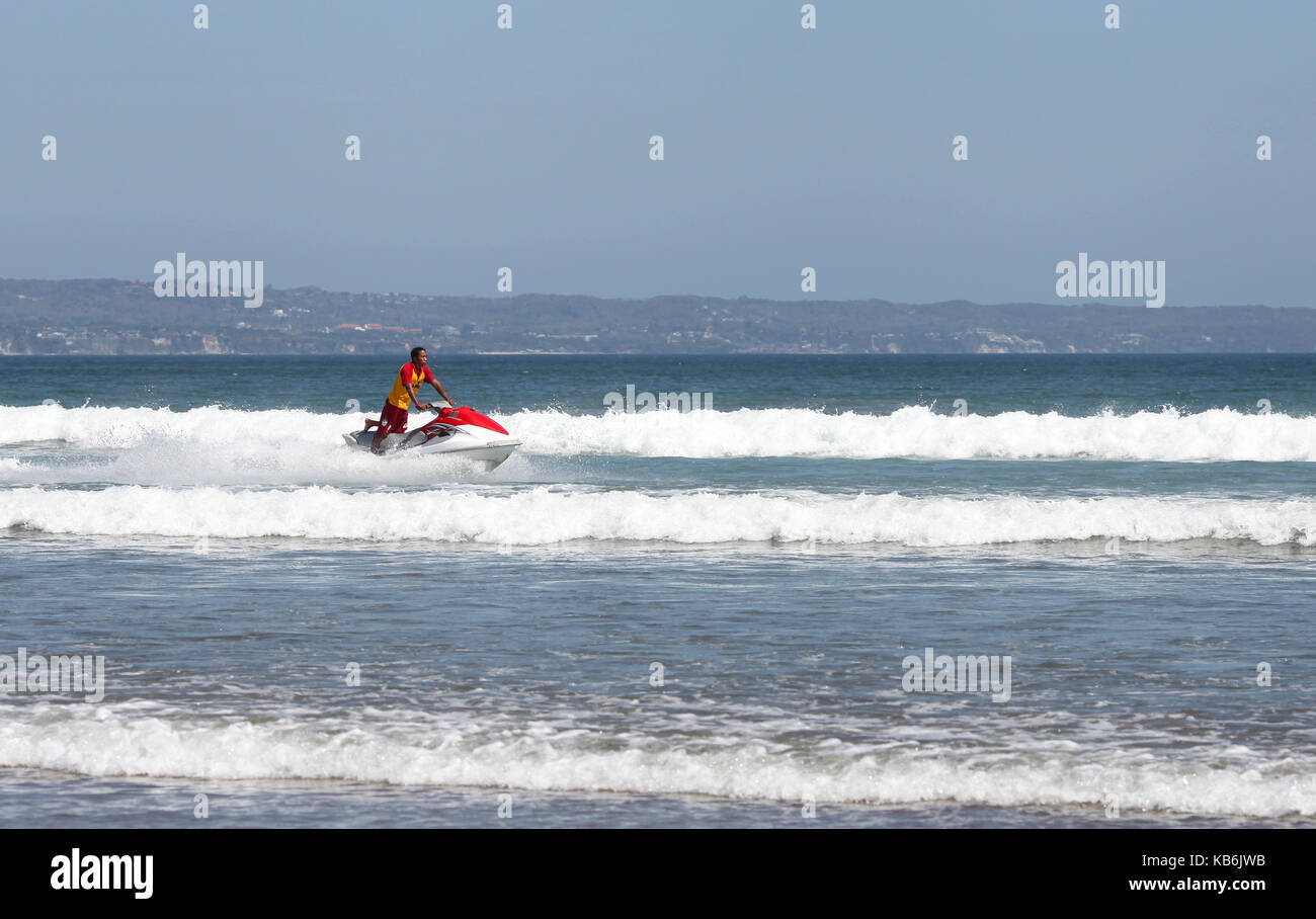 The coastal rescuer floating on the waves. Stock Photo
