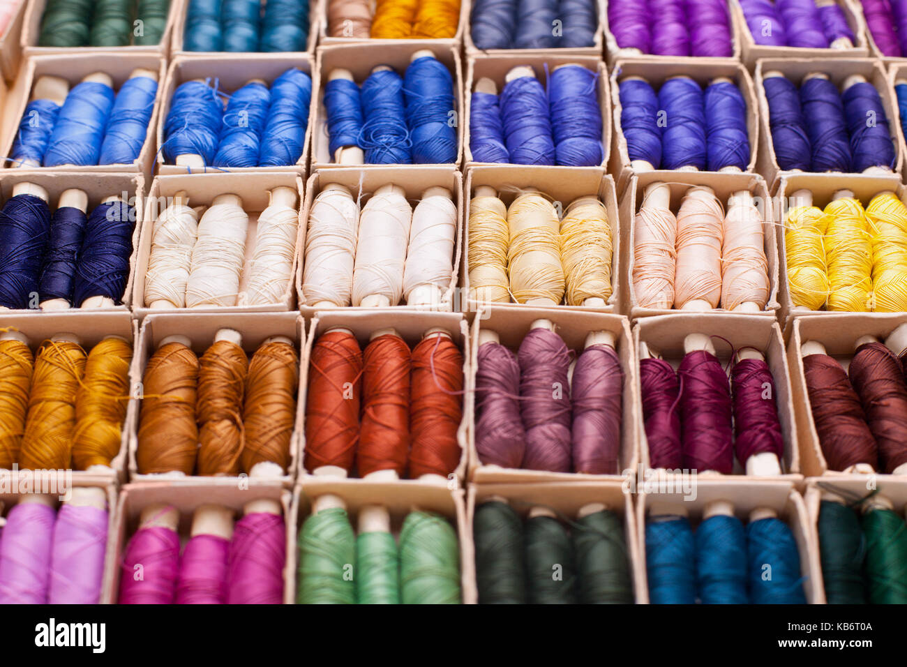 Colored threads for sewing machine in box Stock Photo - Alamy