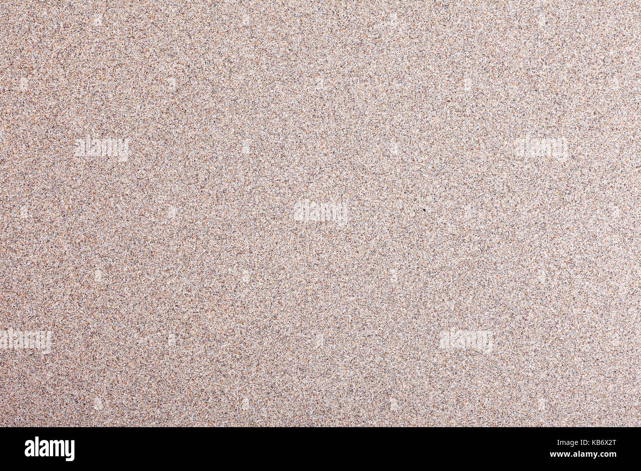 Texture or background of sand beach. Sand of the Cantabrian Sea. Stock Photo
