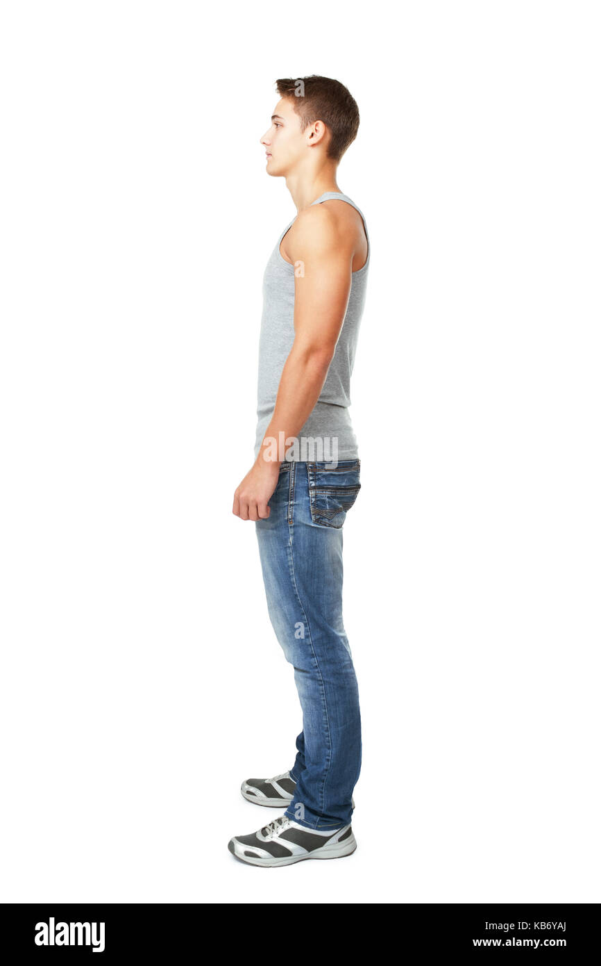 Full length side view portrait of young man isolated on white background Stock Photo