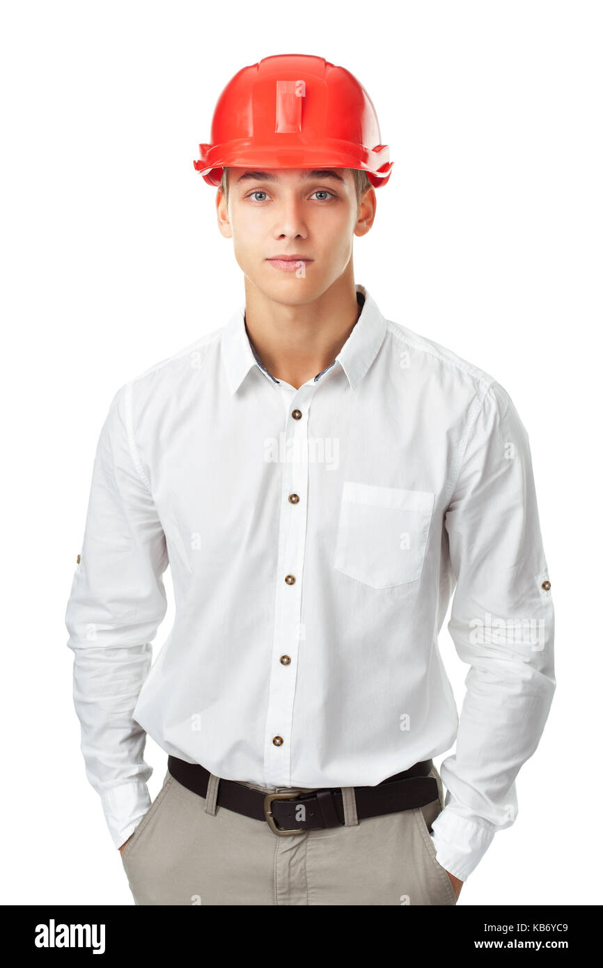 Portrait of young engineer wearing red helmet standing isolated on white background Stock Photo