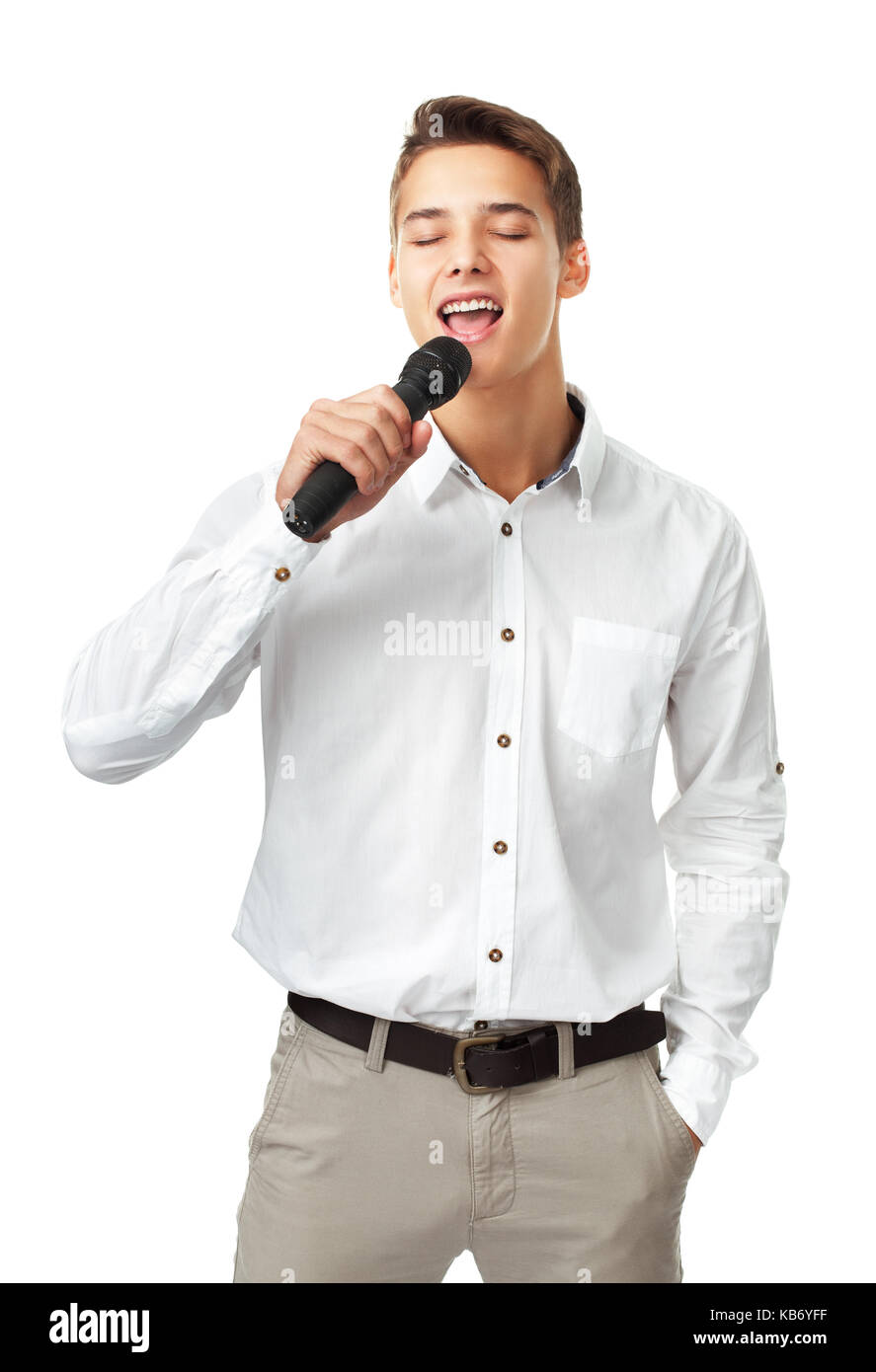 Young man singing into a microphone isolated on white background Stock