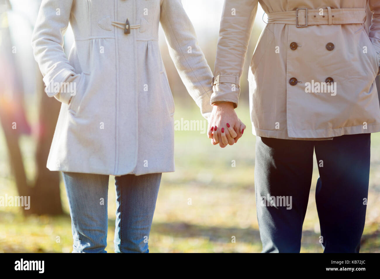 Closeup couple holding hands walking hi-res stock photography and ...