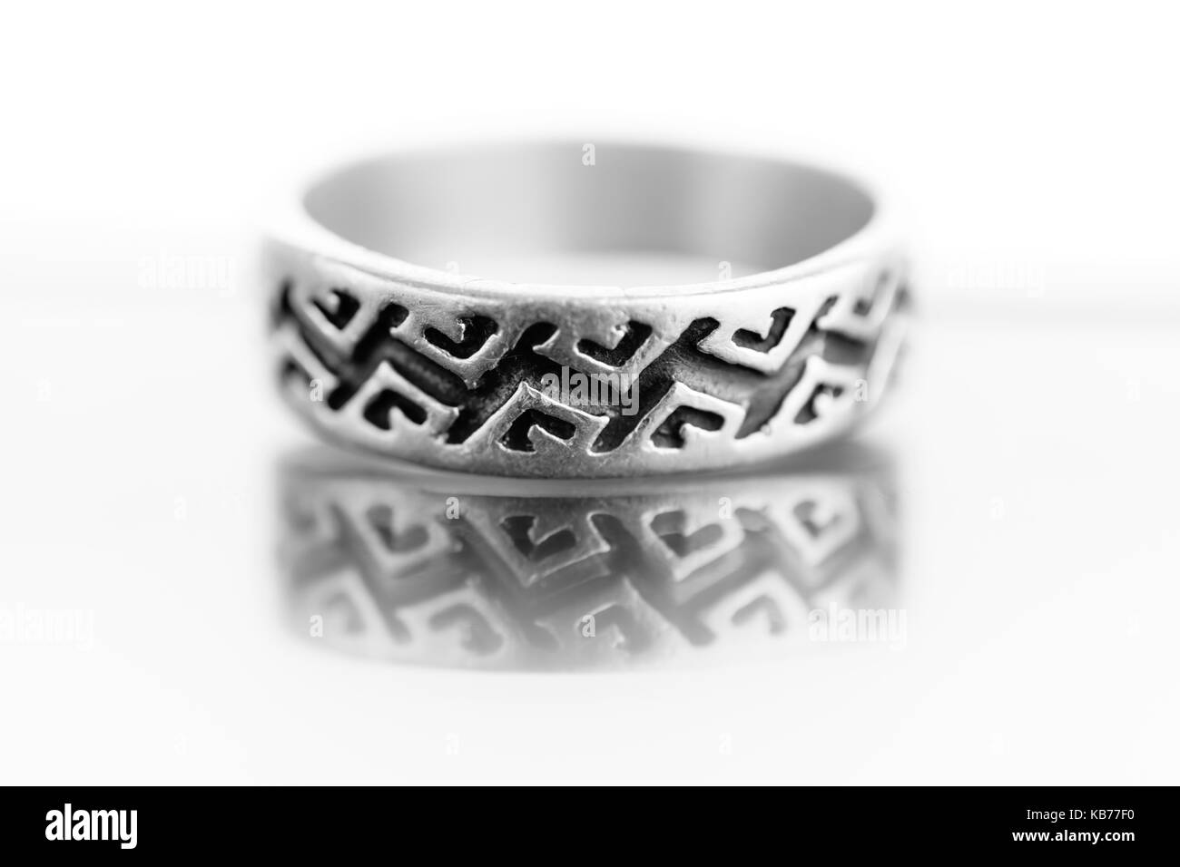 Close-Up Of Engraved Silver Ring Isolated On White Background Stock Photo