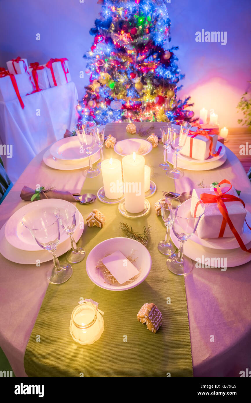 Moody Christmas table setting with Christmas tree Stock Photo Alamy