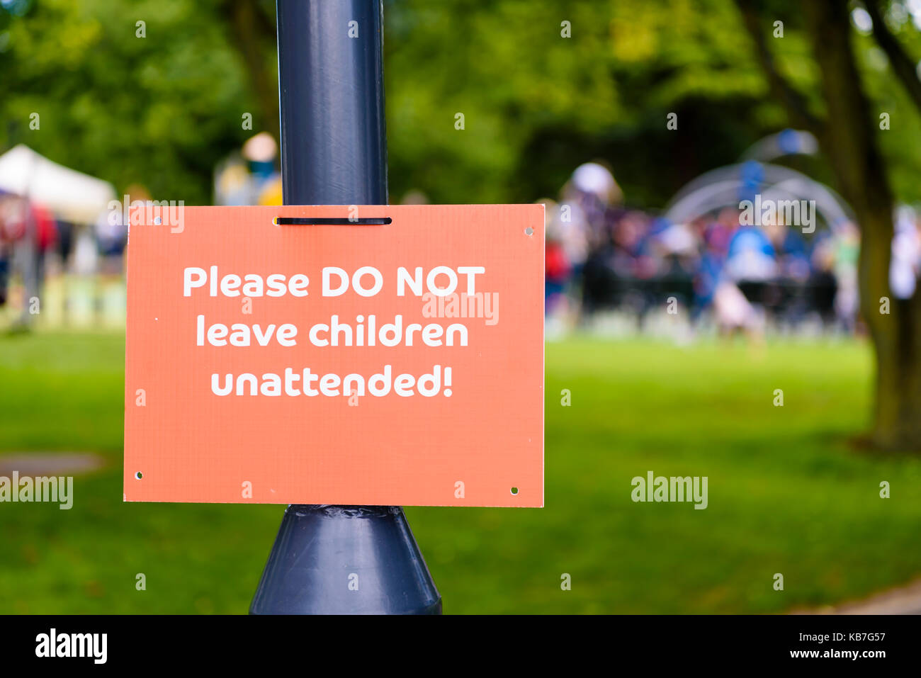 Sign at a children's playpark warning parents not to leave children