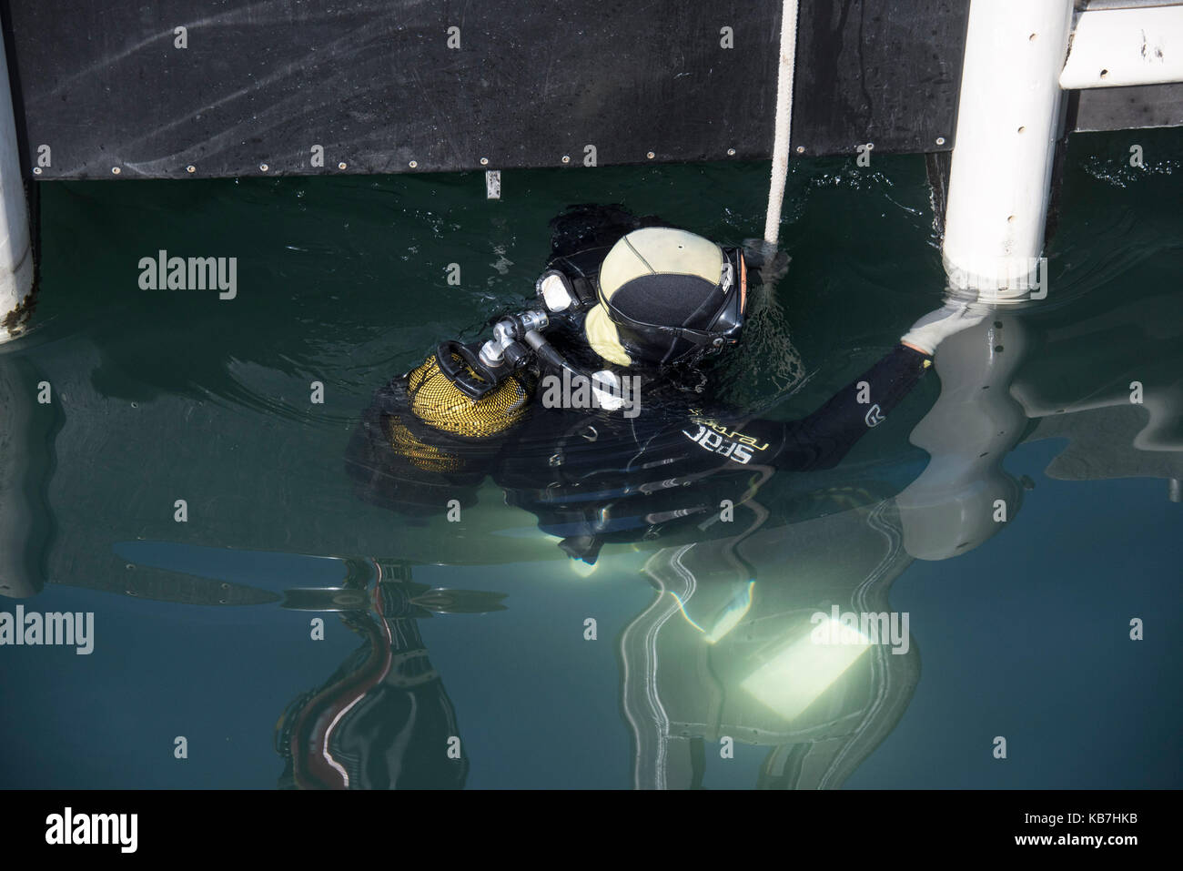 Diver Half Submerged In St Tropez Harbour Stock Photo Alamy