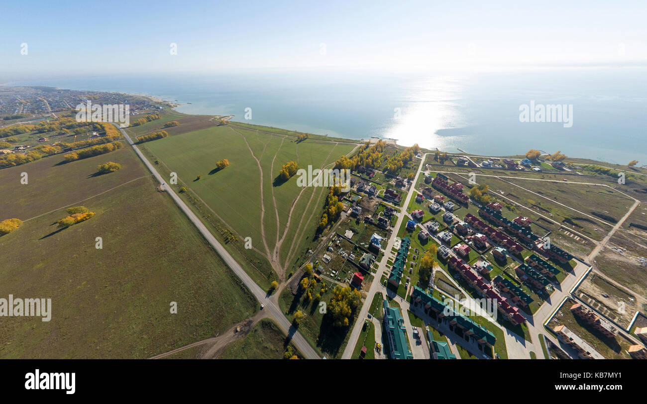 Aerial view of a summer house village at blue sea coast. Stock Photo