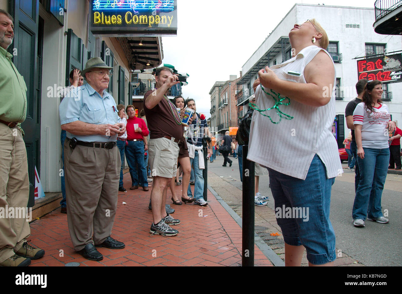 New Orleans, Louisiana, USA - 2016: A woman shows her breasts in