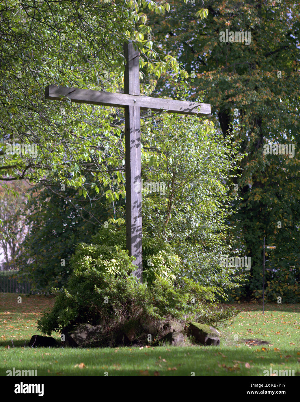 life size wooden cross in woods christian symbol Stock Photo