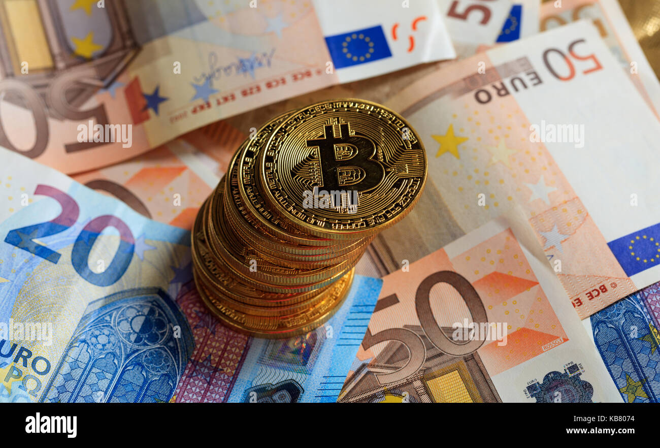 Bitcoins and euros, money and currency exchange rate concept Stock Photo -  Alamy