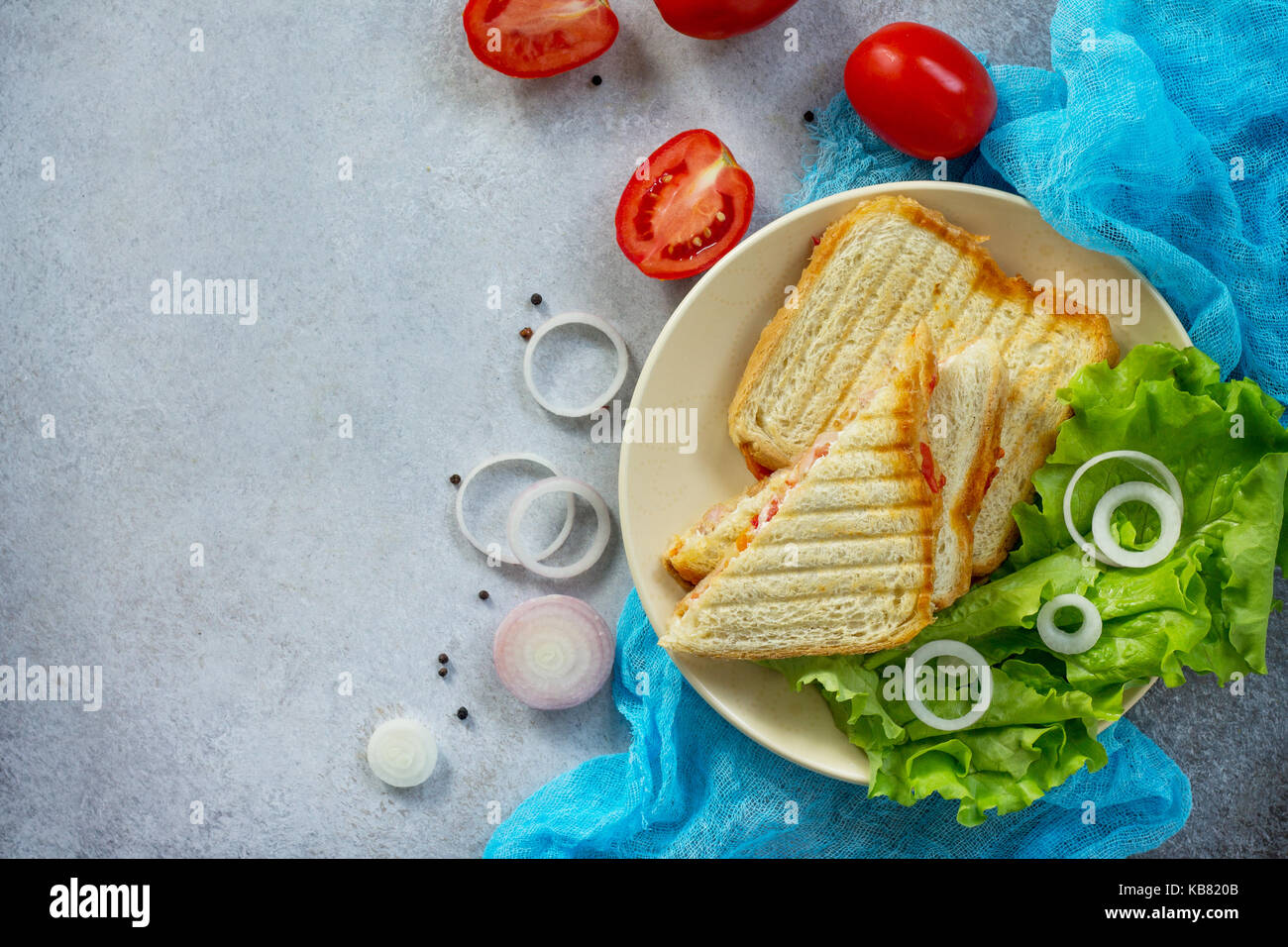 Double sandwich with canned tuna and feta cheese served with lettuce