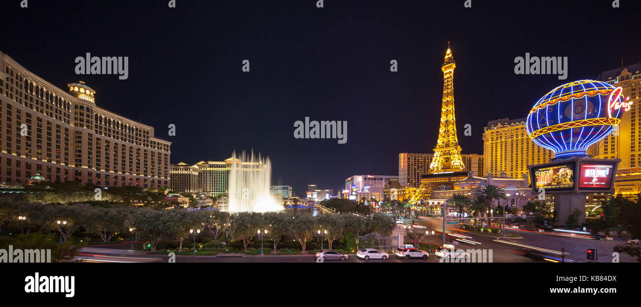 A skyline nighttime view of several casino's and resort on Las Vegas Blvd in Las Vegas, Nevada including the Fountains at Bellagio water show. Stock Photo