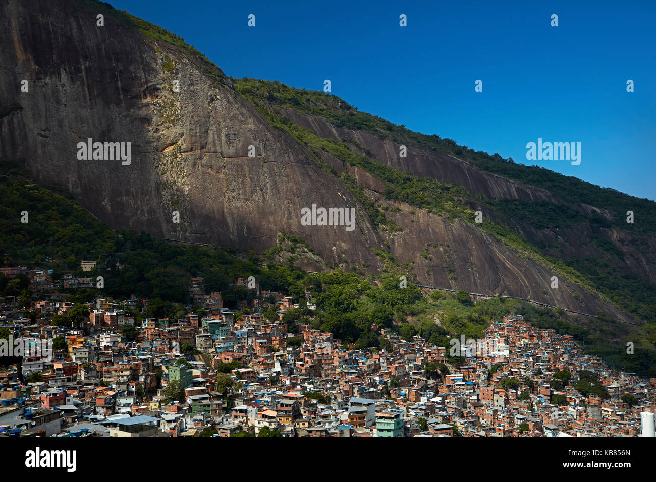 Rocinha favela (Brazil's largest favela), and Morro Dois Irmãos (rock hill), Rio de Janeiro, Brazil, South America Stock Photo
