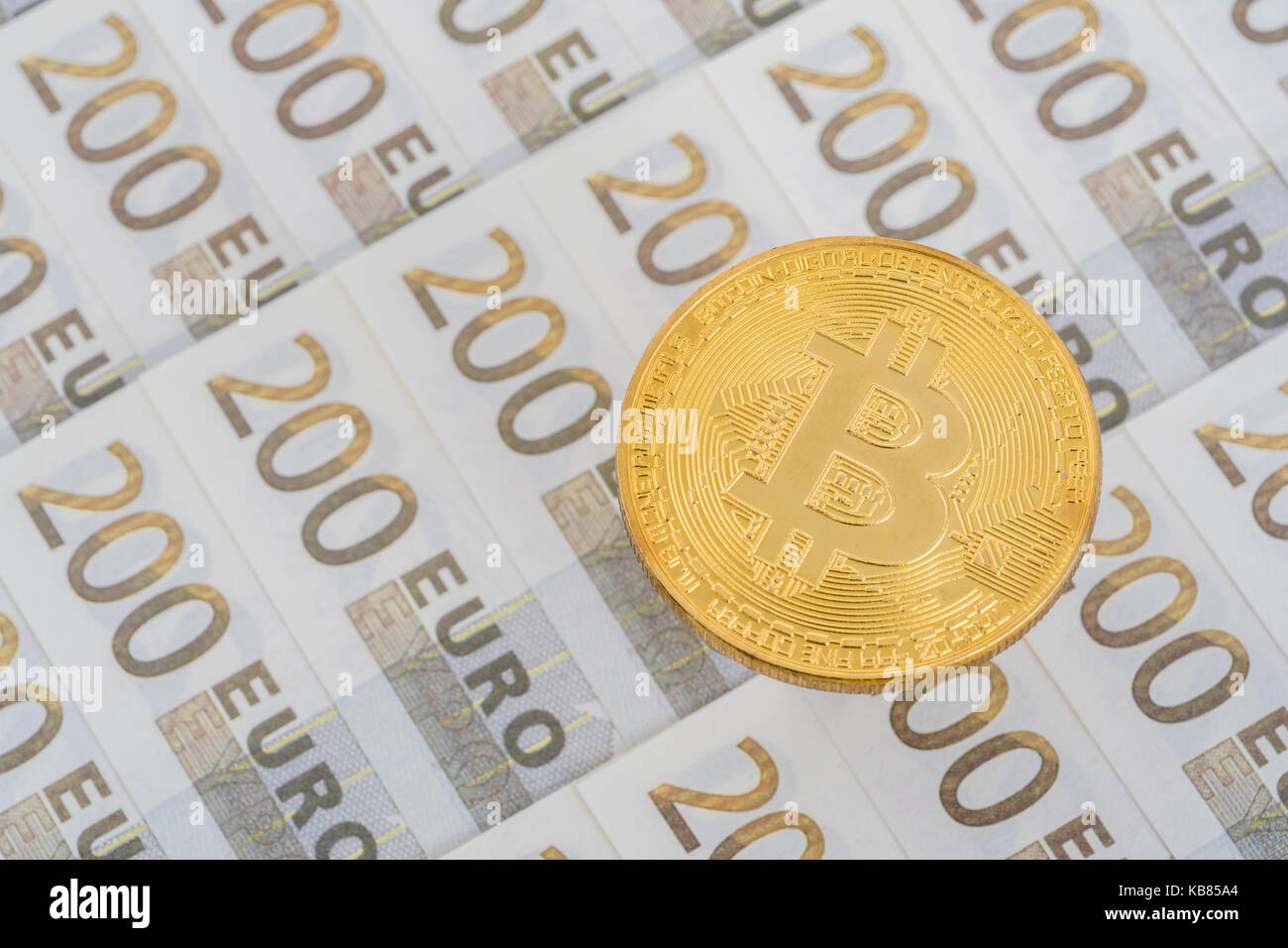 Gold Bitcoin on 200 Euro banknote. For European Digital Single Market, Bitcoin-Euro exchange rate, EU e-commerce, EU Bitcoin regulation, Bitcoin surge Stock Photo