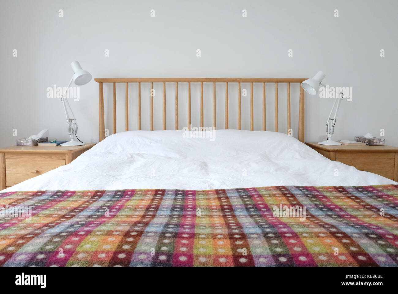 View of Scandinavian inspired bedroom interior showing wooden bedroom furniture ...